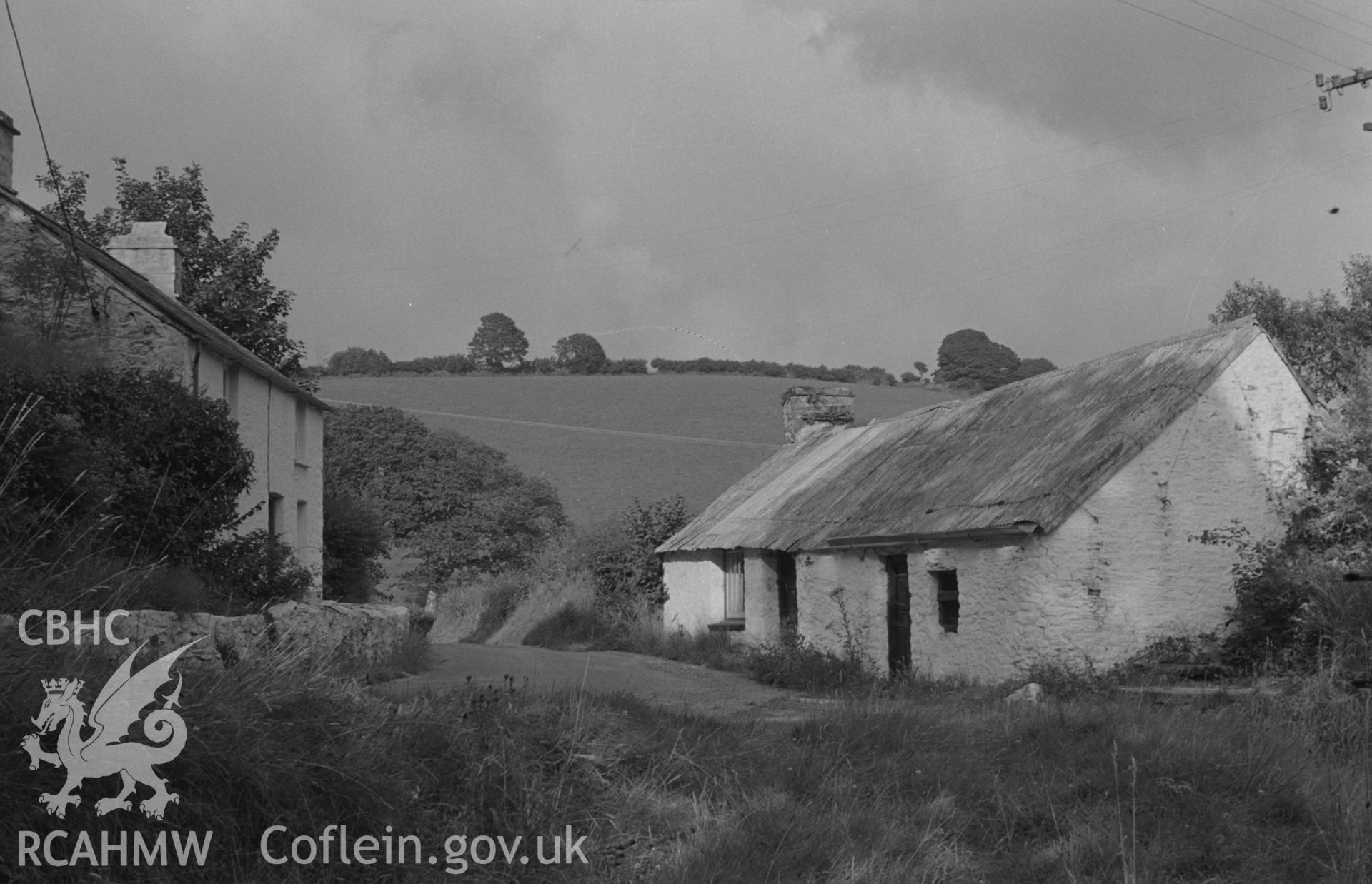 Digital copy of a black and white negative showing mill and cottages at Melin Cwm-Hyar on the Cerdin, 2.5 km south east of Ffostrasol. Photographed by Arthur O. Chater on 18th August 1967, looking east from Grid Reference SN 391 459.