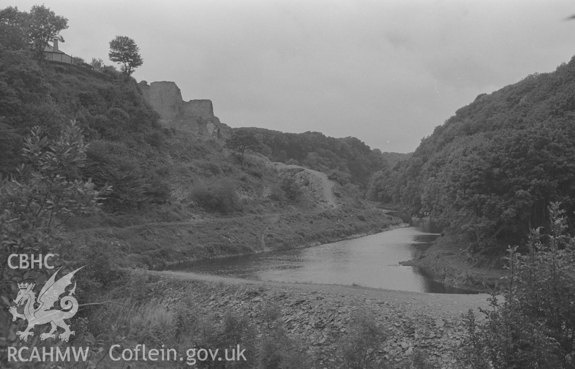 Digital copy of a black and white negative showing Cilgerran castle overlooking the Teifi, with Coedmore woods on the right. Photographed in September 1963 by Arthur O. Chater from Grid Reference SN 1973 4296, looking north west.