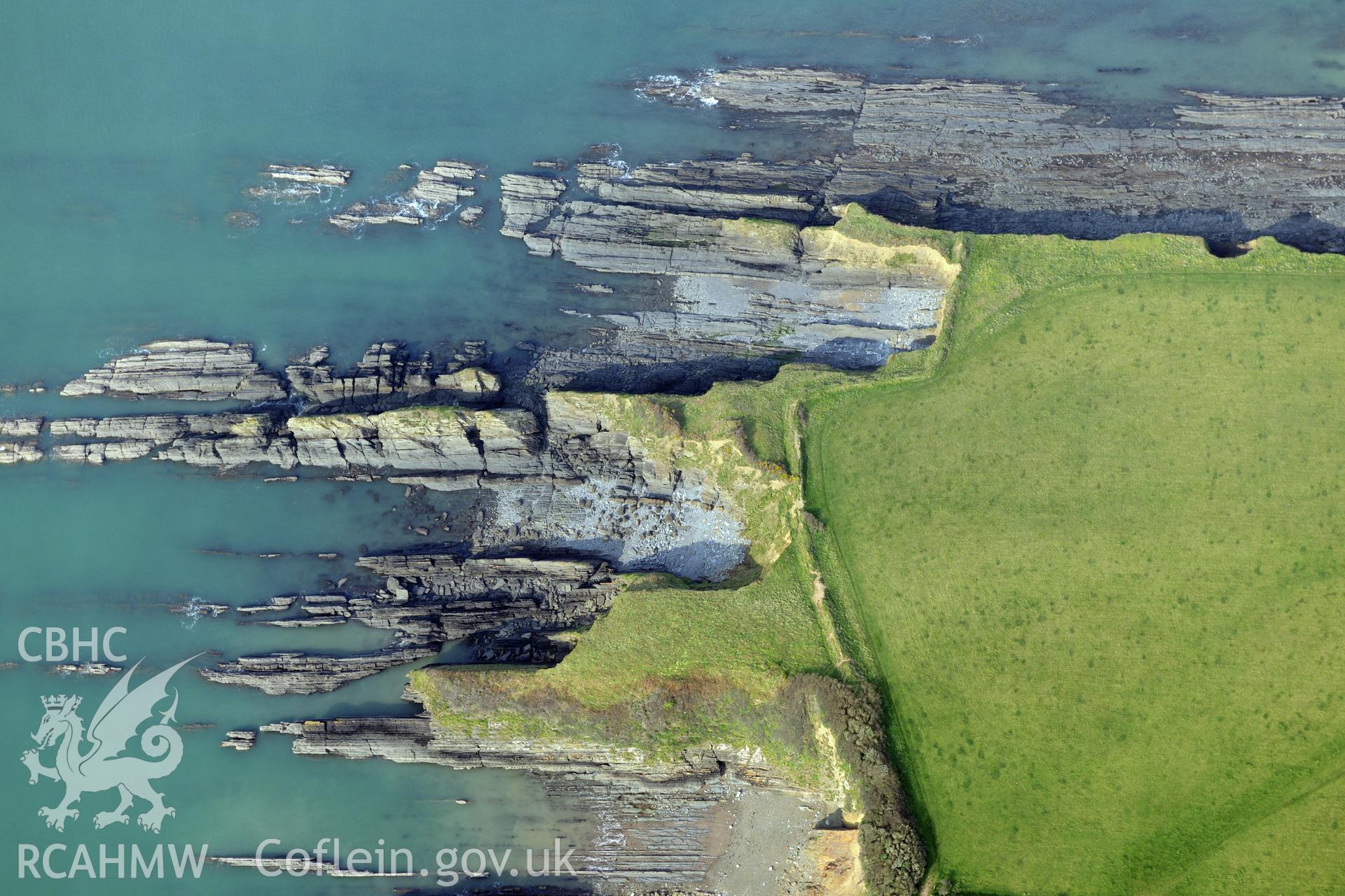 Royal Commission aerial photograph of West Angle Bay promontory fort taken on 27th March 2017. Baseline aerial reconnaissance survey for the CHERISH Project. ? Crown: CHERISH PROJECT 2017. Produced with EU funds through the Ireland Wales Co-operation Programme 2014-2020. All material made freely available through the Open Government Licence.