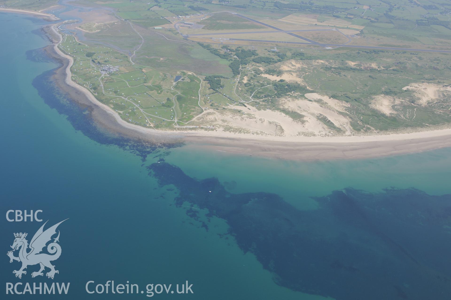 Sarn Padrig Reef and Mochras Spit, off the coast of Llaneddwyn, Dyffryn Ardudwy, Gwynedd. Oblique aerial photograph taken during the Royal Commission?s programme of archaeological aerial reconnaissance by Toby Driver on 12th July 2013.