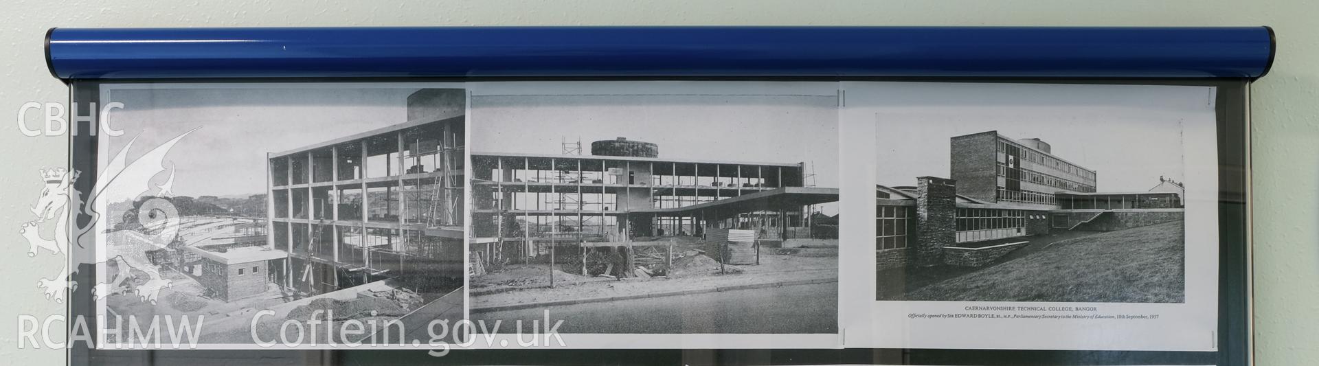 Digital colour photograph showing detailed view of black and white photographs of Caernarfonshire Technical College under construction. Photographed by Dilys Morgan and donated by Wyn Thomas of Grwp Llandrillo-Menai Further Education College, 2019.