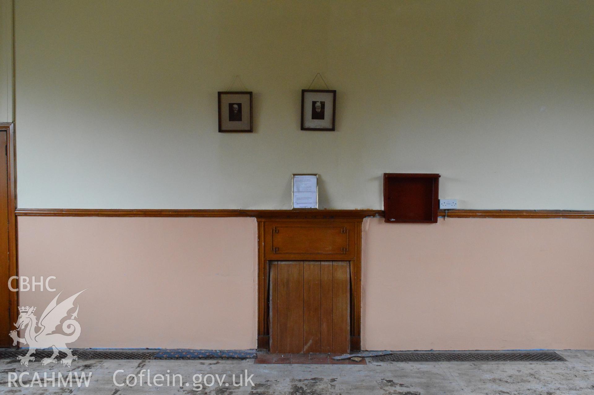 Internal view of the east elevation in the eastern room (fireplace). Digital colour photograph taken during CPAT Project 2396 at the United Reformed Church in Northop. Prepared by Clwyd Powys Archaeological Trust, 2018-2019.