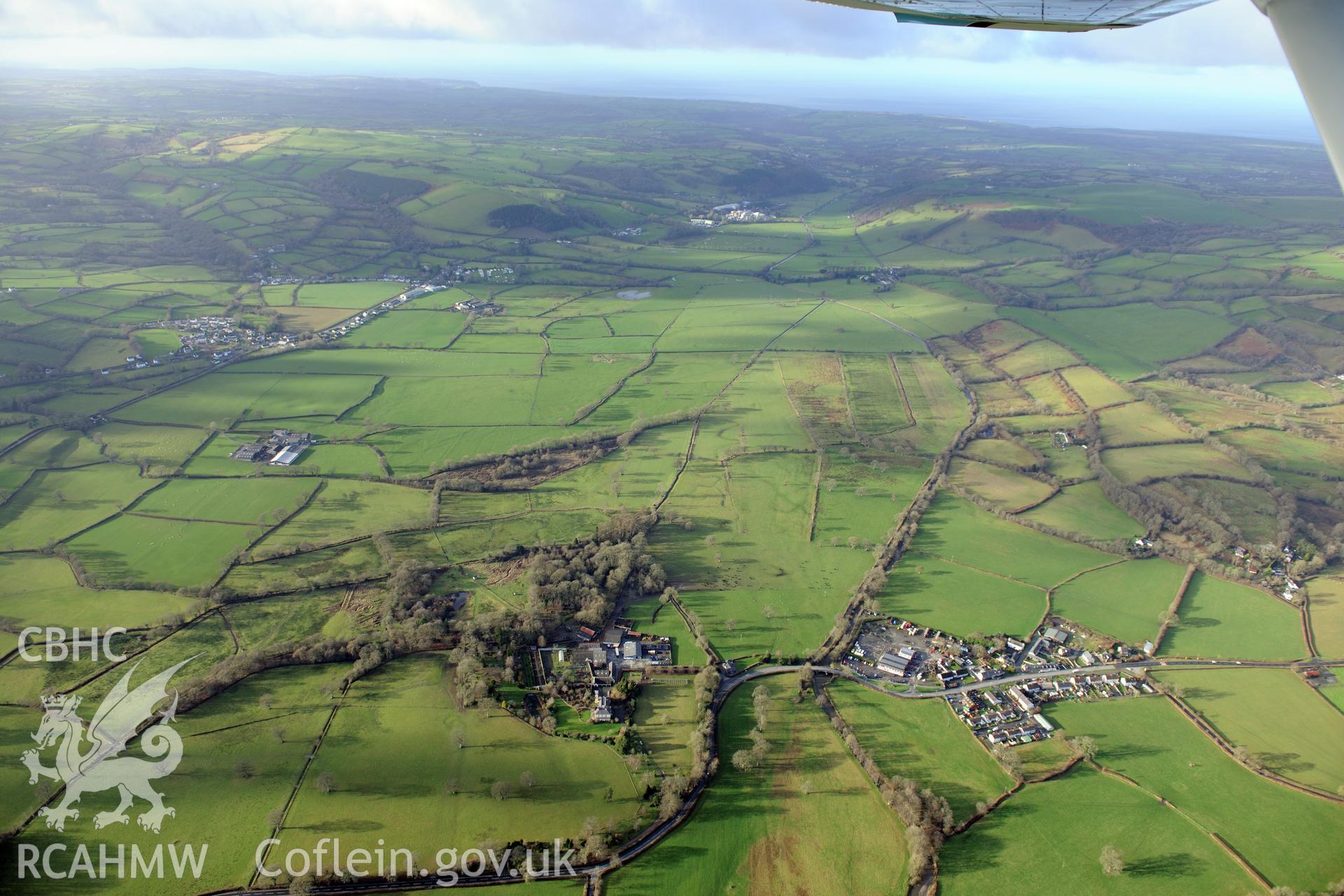 Talsarn village, and Llanllyr manison and gardens. Oblique aerial photograph taken during the Royal Commission's programme of archaeological aerial reconnaissance by Toby Driver on 6th January 2015.