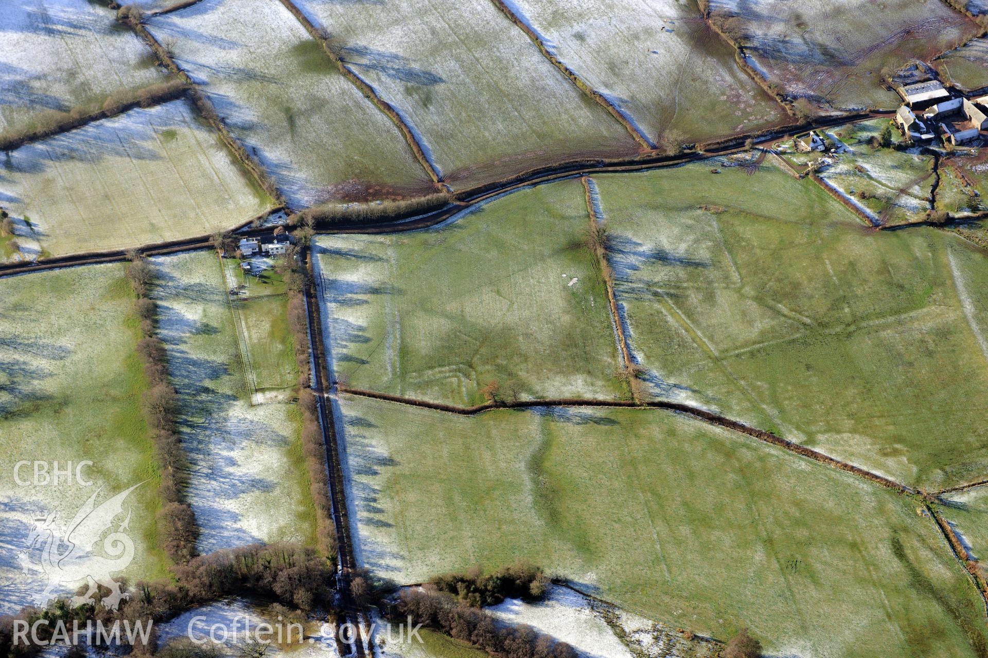Treberfydd moated site, Llangors, south east of Brecon. Oblique aerial photograph taken during the Royal Commission?s programme of archaeological aerial reconnaissance by Toby Driver on 15th January 2013.