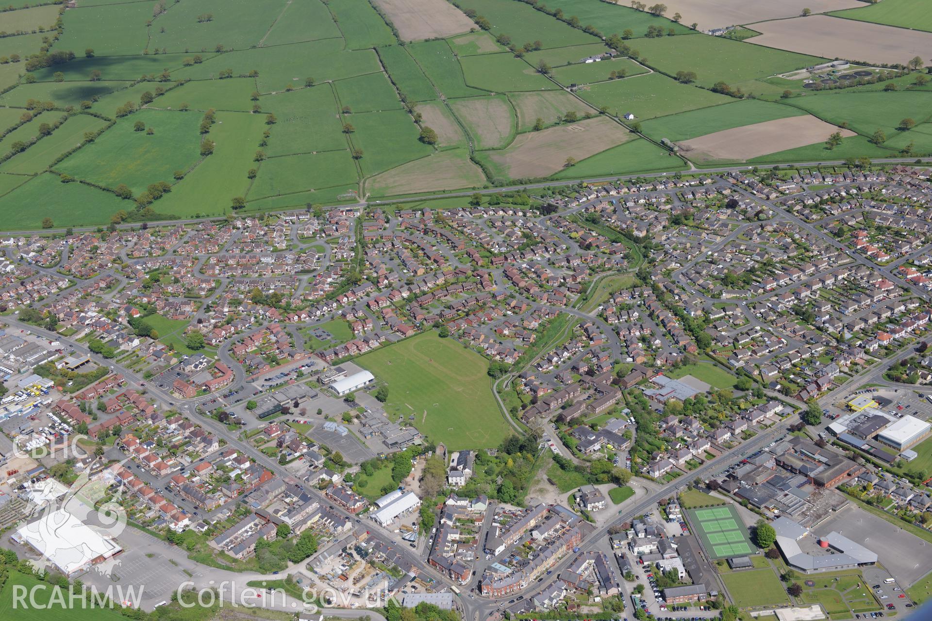 Denbigh High School and Denbigh Town AFC football pitch (US Army landing ground), Denbigh. Oblique aerial photograph taken during the Royal Commission?s programme of archaeological aerial reconnaissance by Toby Driver on 22nd May 2013.