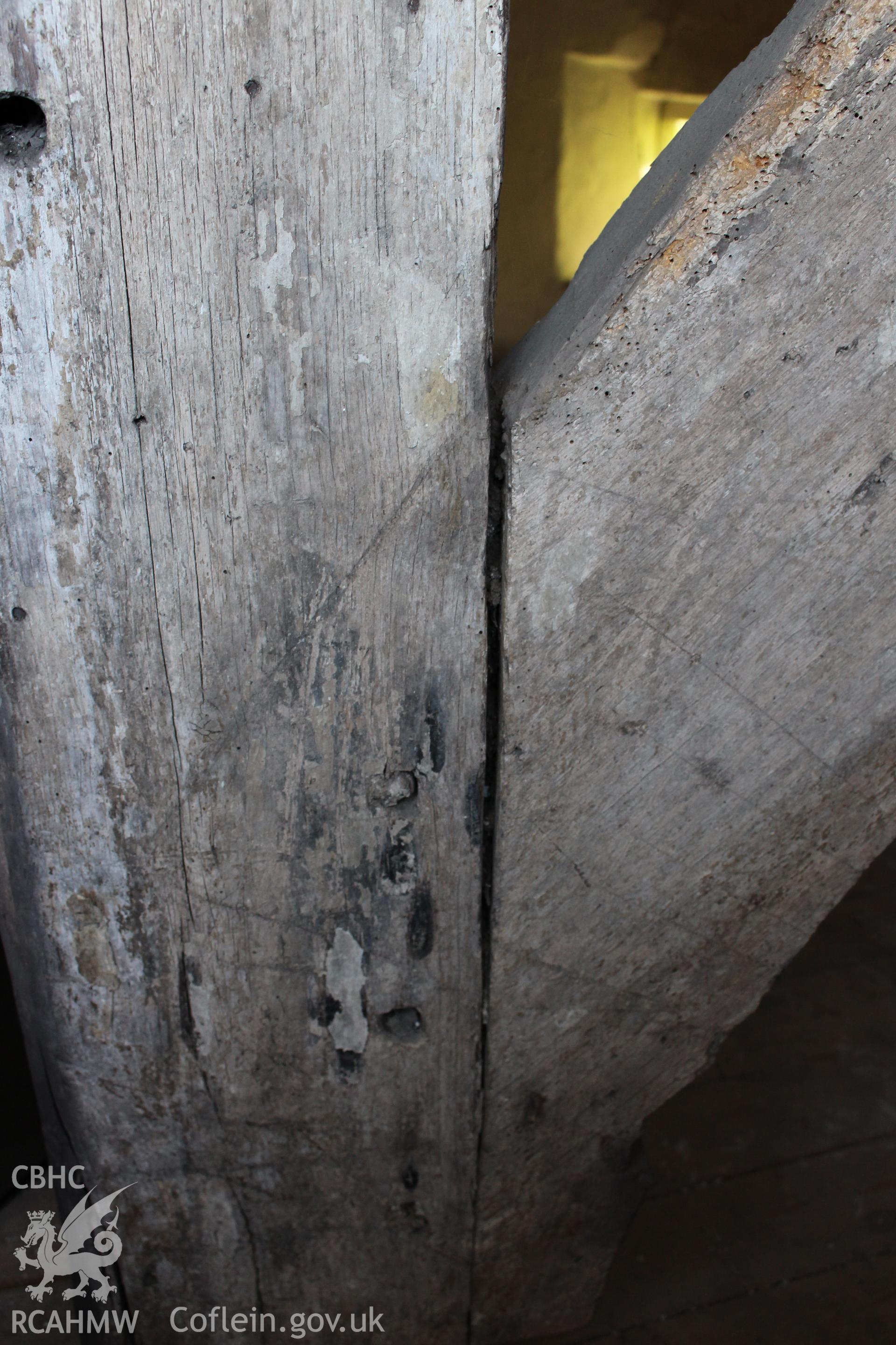 Colour photograph showing detail of timber truss at 5-7 Mwrog Street, Ruthin. Photographed during survey conducted by Geoff Ward on 14th May 2014.