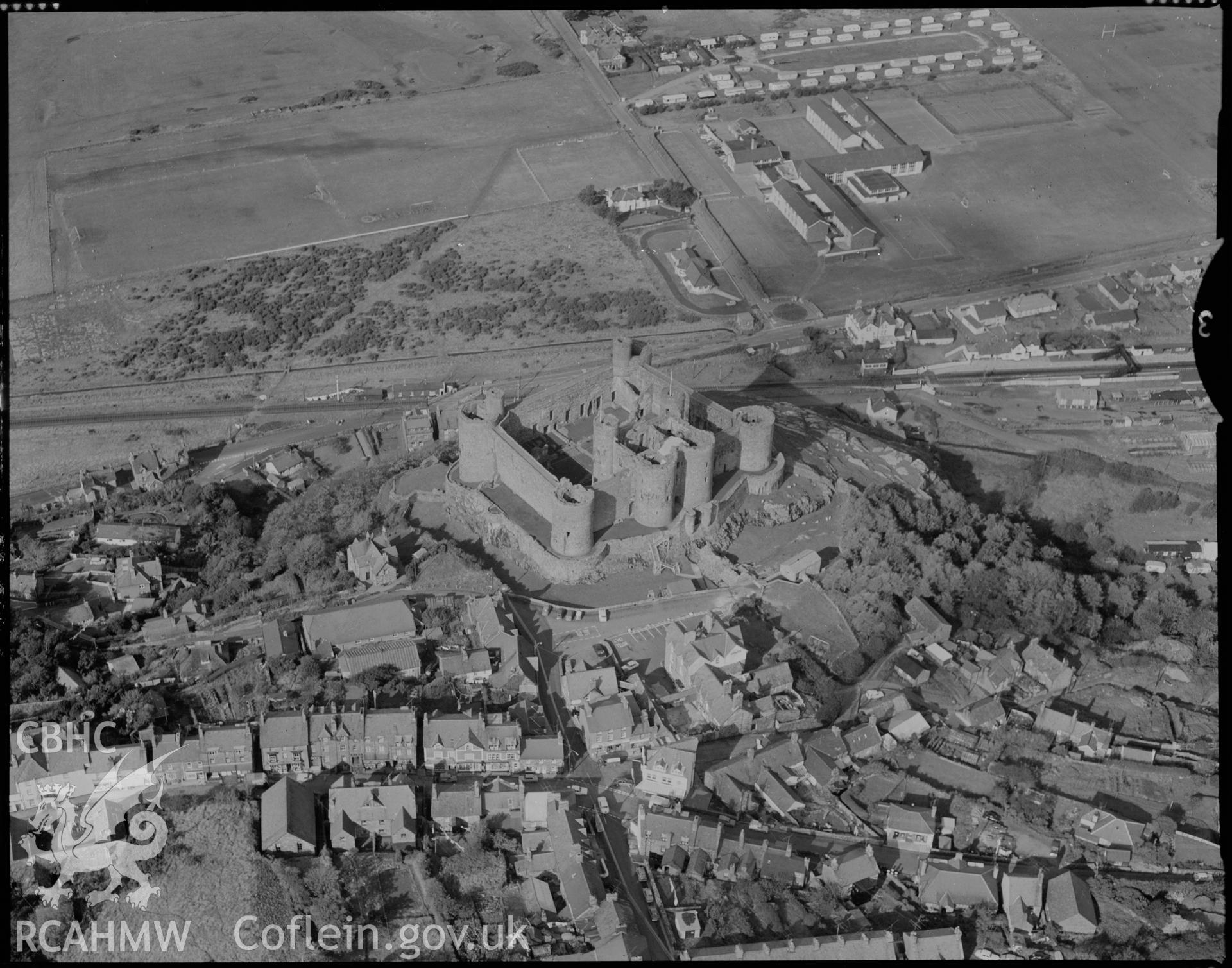 Digital copy of a black and white negative showing an aerial view of excavations at Harlech Castle.