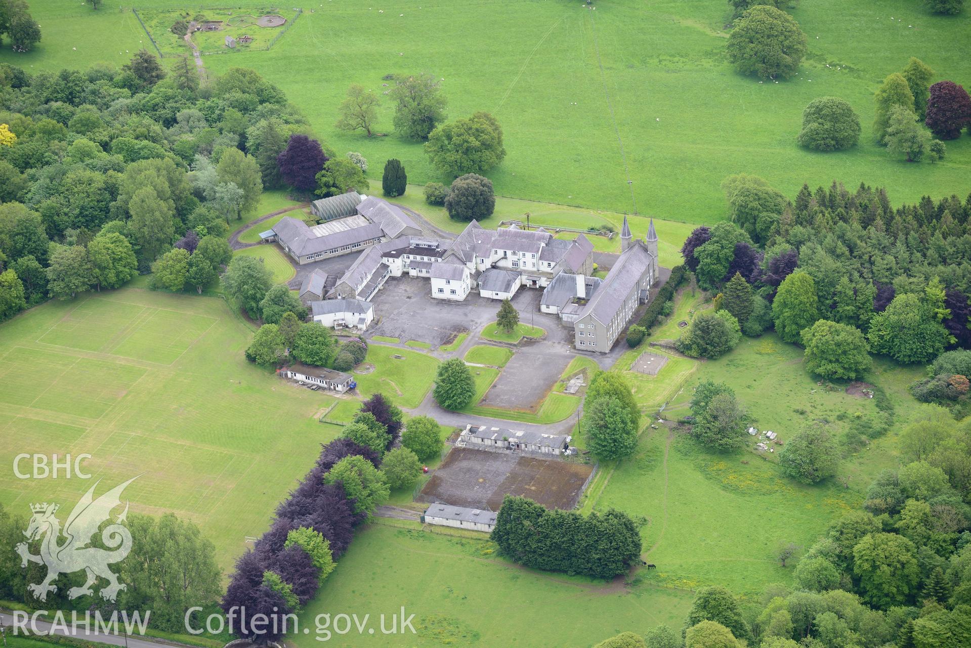 Highmead house and garden, Llanybydder. Oblique aerial photograph taken during the Royal Commission's programme of archaeological aerial reconnaissance by Toby Driver on 3rd June 2015.