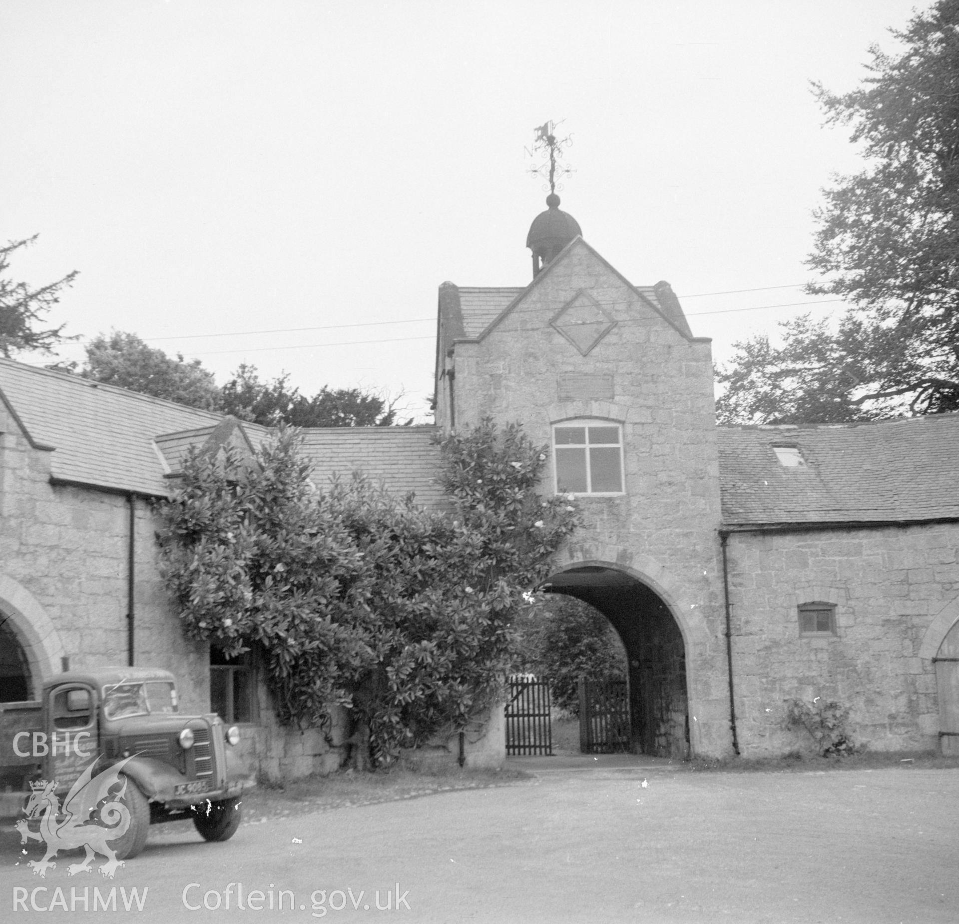 Digital copy of an undated nitrate negative showing view of gateway and courtyard at Bodrhyddan Hall, Rhuddlan, Flintshire.