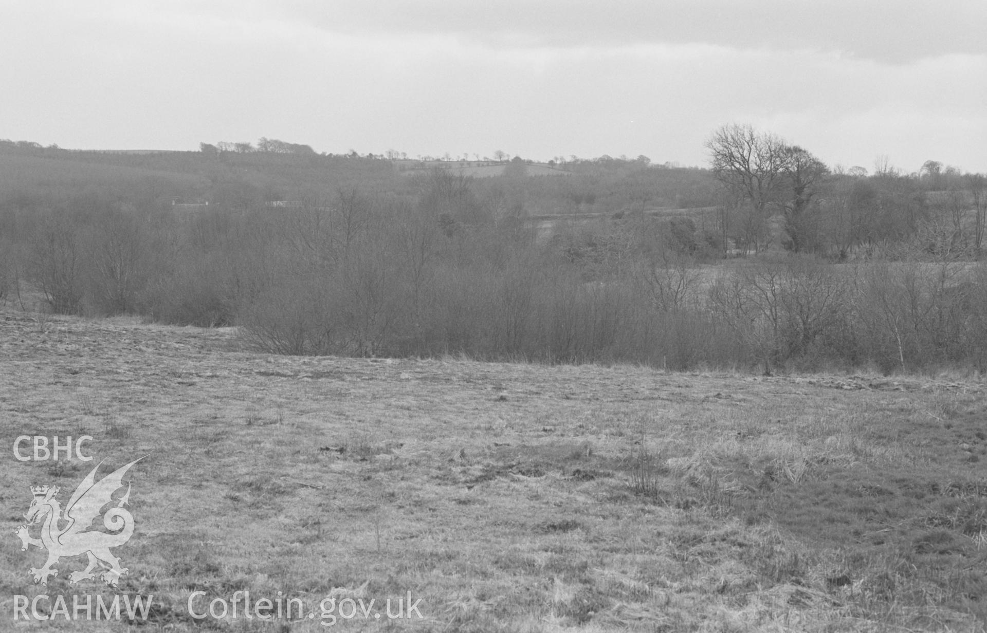 Digital copy of a black and white negative showing panorama of Llangybi Common; Nant-glas-fach on left, Nant Meurig in bushes in centre. Photographed by Arthur O. Chater in April 1968. [3 of 3]