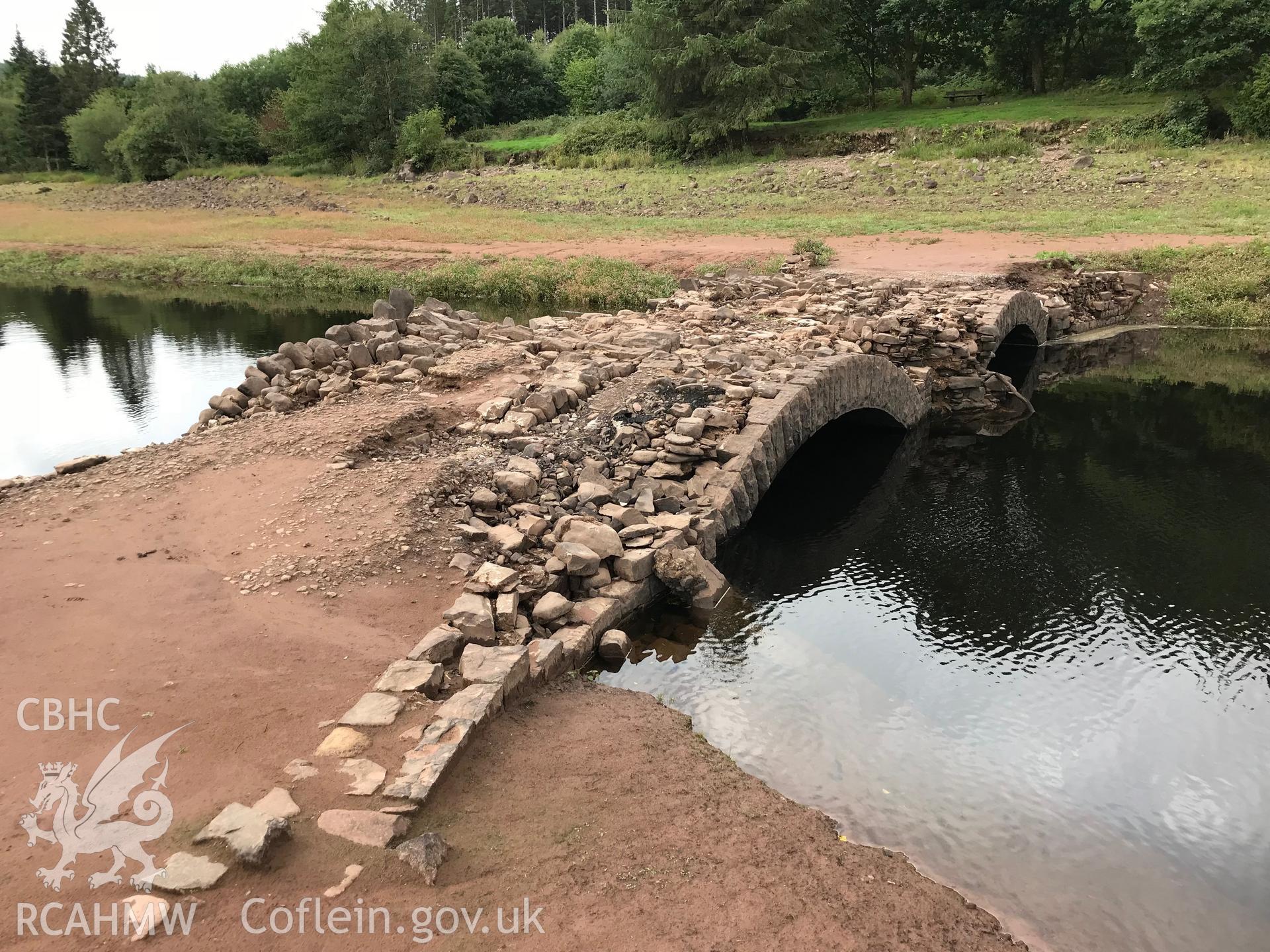 Pont ar Daf - usually submerged by the Llwyn-on reservoir but revealed during the drought conditions of the summer of 2018. Colour photograph taken by Paul R. Davis on 25th August 2018.