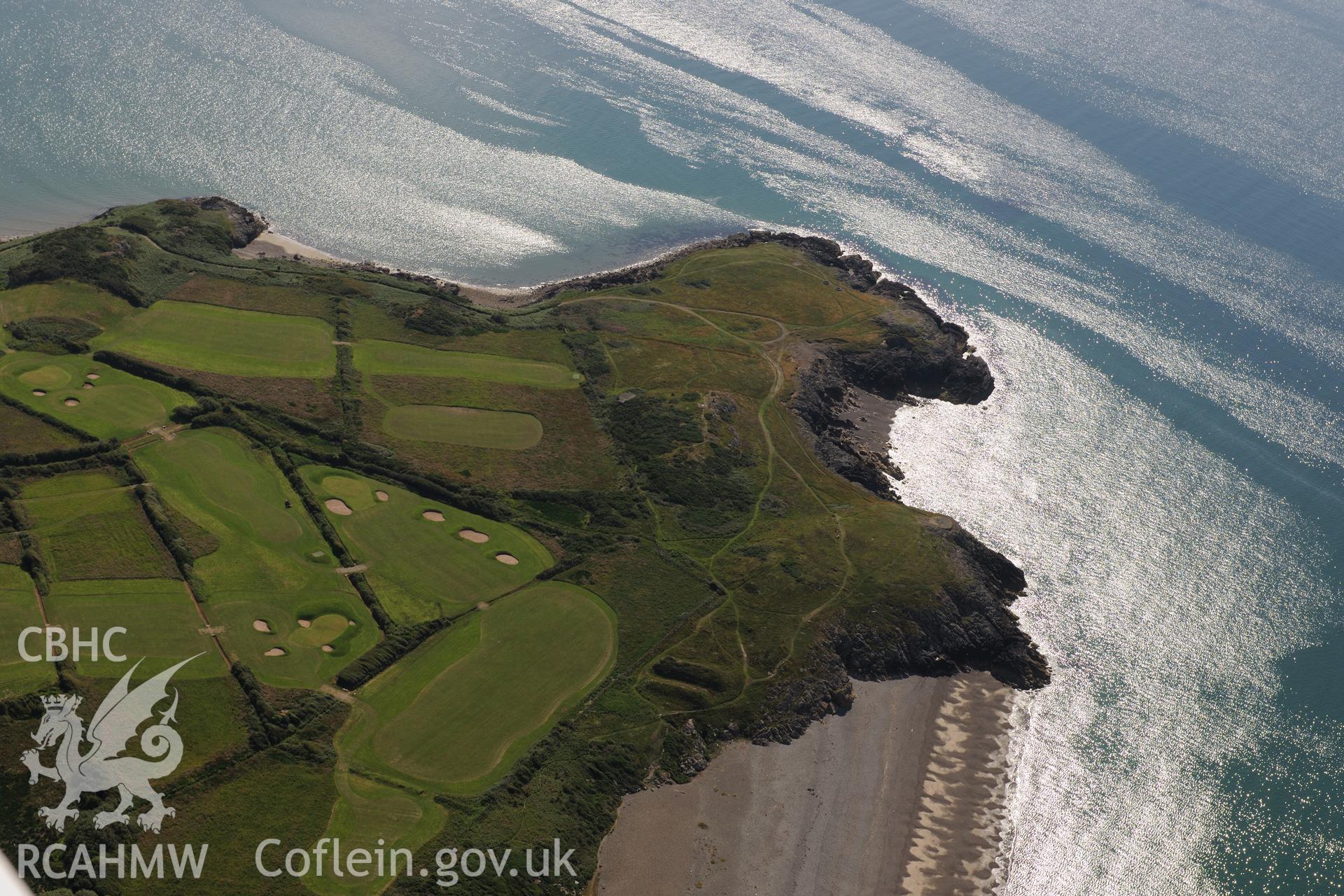 Flint find spot on the cliffs and a disused rifle range on Pen-ychain beach. Oblique aerial photograph taken during the Royal Commission's programme of archaeological aerial reconnaissance by Toby Driver on 23rd June 2015.