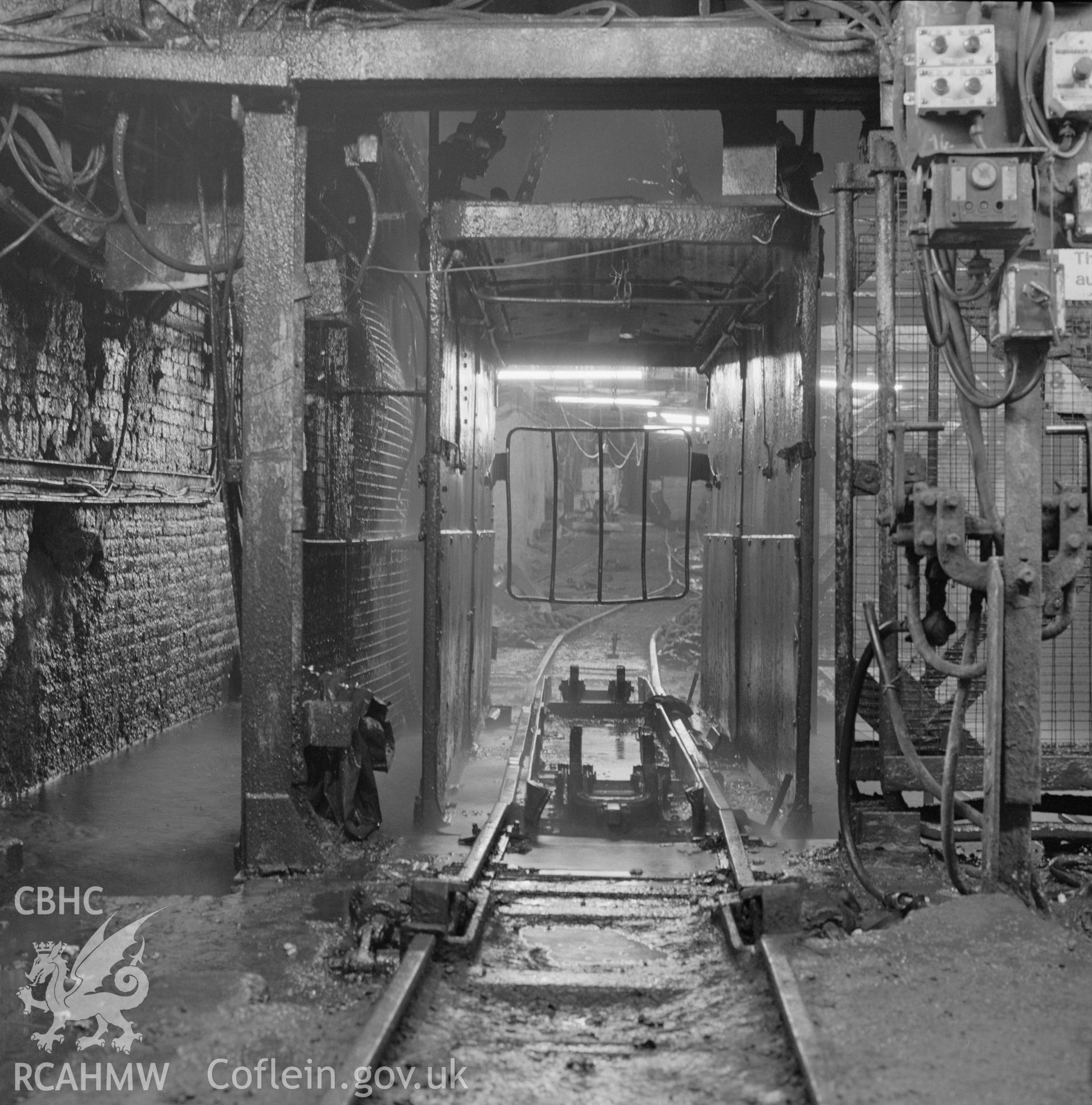 Digital copy of an acetate negative showing cage at pit bottom downcast shaft at Marine Colliery, from the John Cornwell Collection.