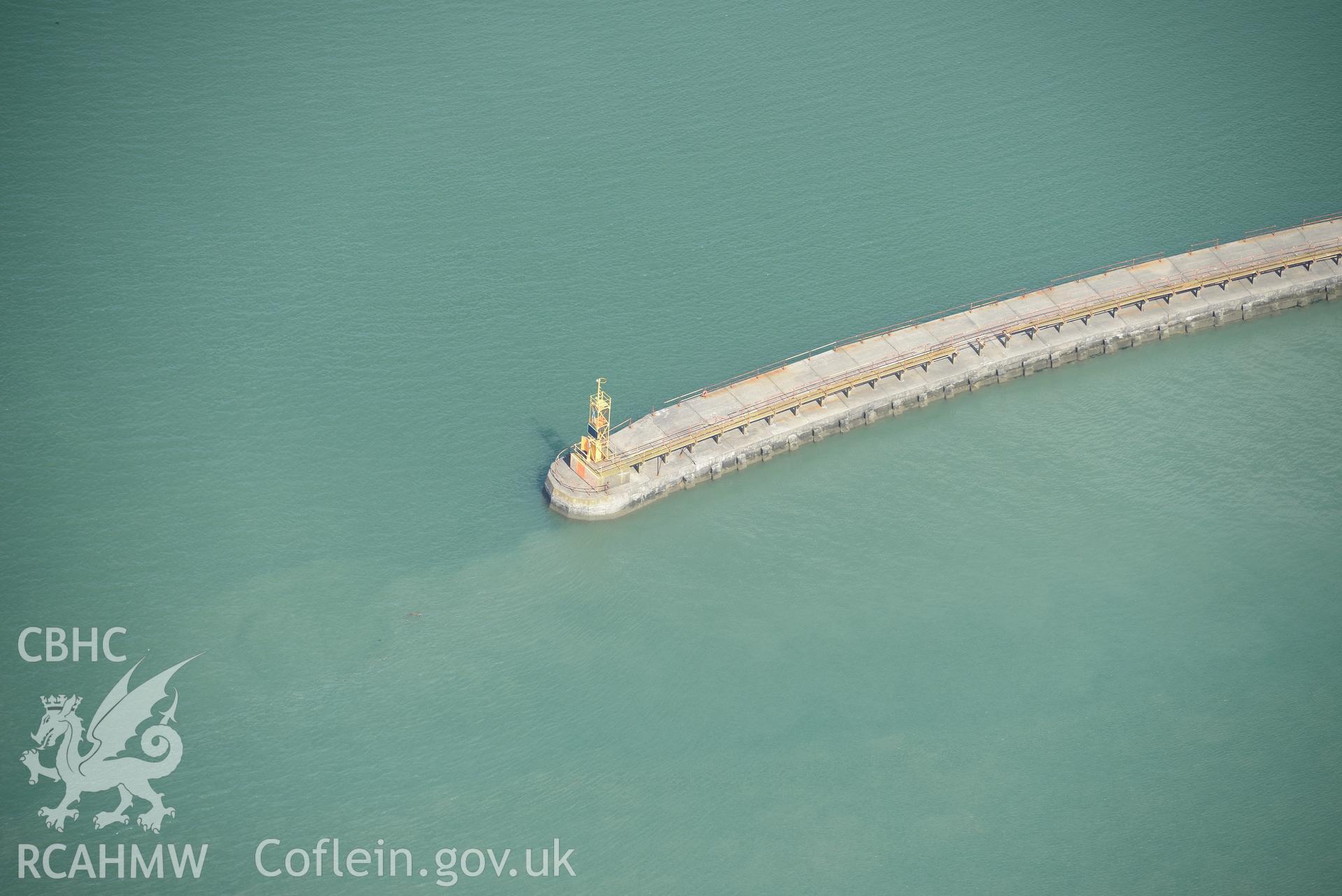 Swansea Harbour lighthouse on the east pier. Oblique aerial photograph taken during the Royal Commission's programme of archaeological aerial reconnaissance by Toby Driver on 19th June 2015.