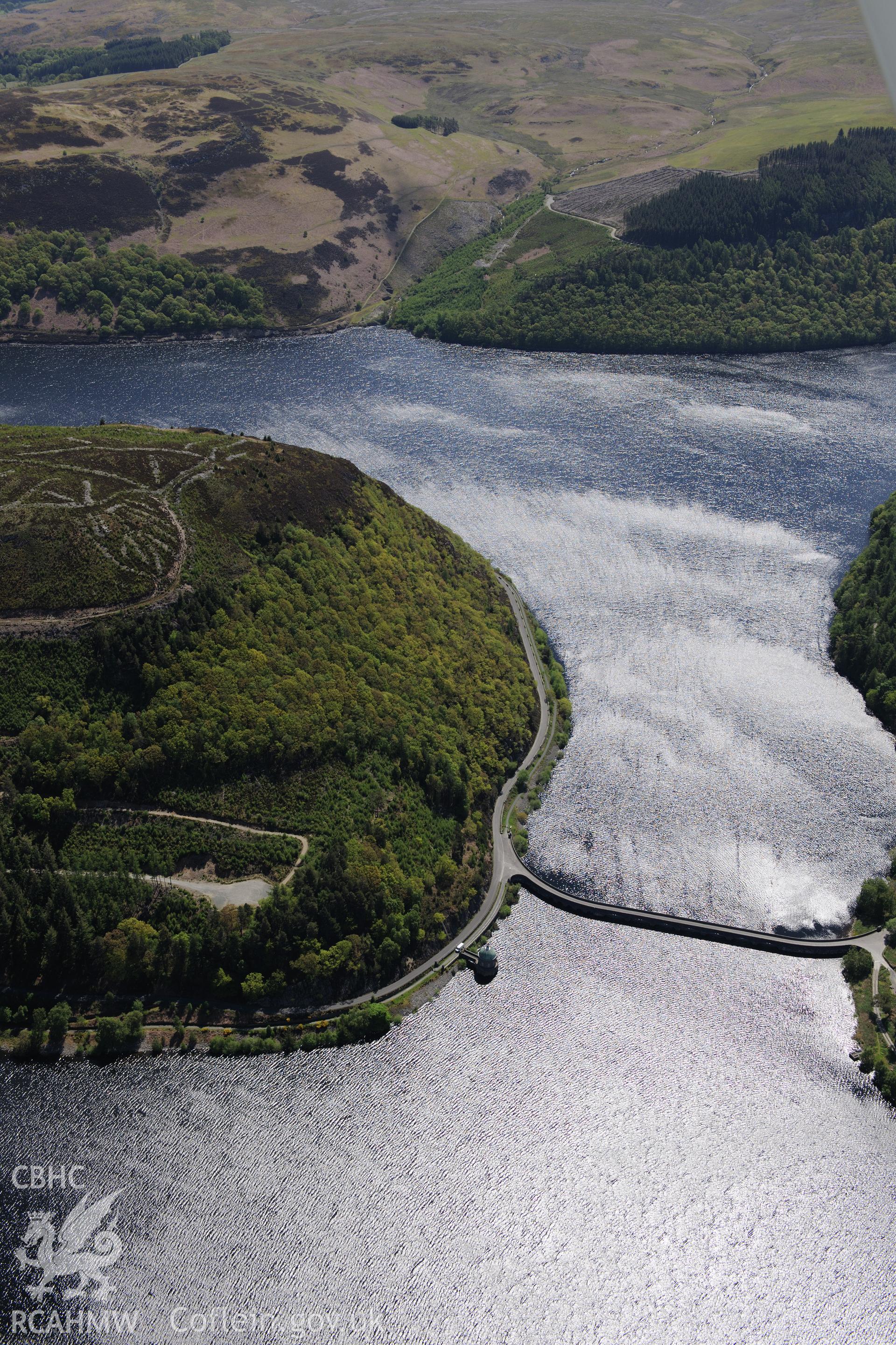 Garreg-Ddu dam and reservoir, and Coed-y-Foel pill boxes at the Elan Valley water scheme. Oblique aerial photograph taken during the Royal Commission's programme of archaeological aerial reconnaissance by Toby Driver on 3rd June 2015.