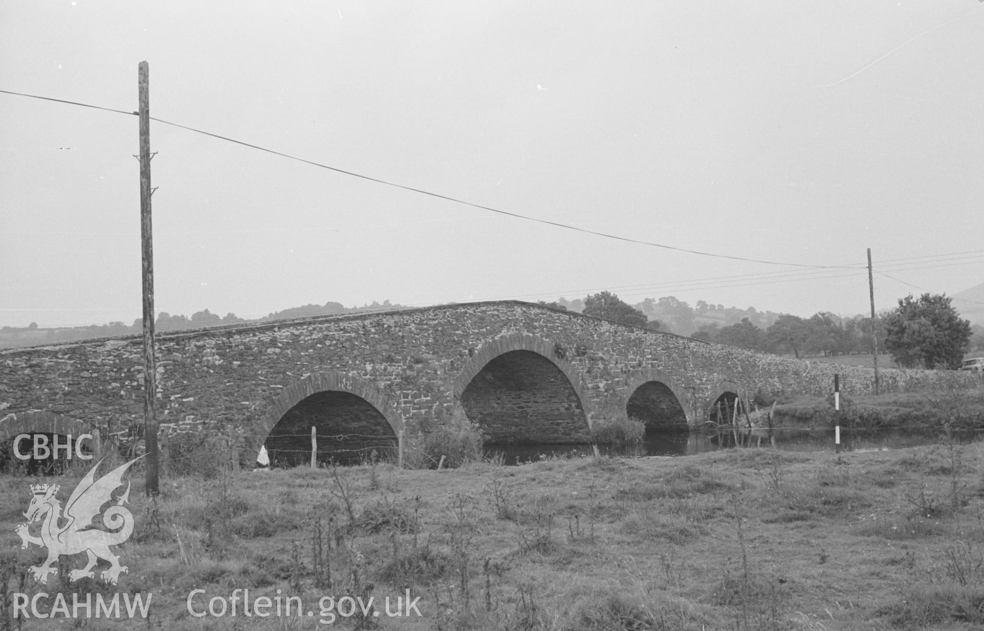 Digital copy of a black and white negative showing view of Pont Gogoyan, crossing the river Teifi just outside Llanddewi Brefi. Photographed by Arthur O. Chater in August 1965 from Grid Reference SN 642 545, looking north east.