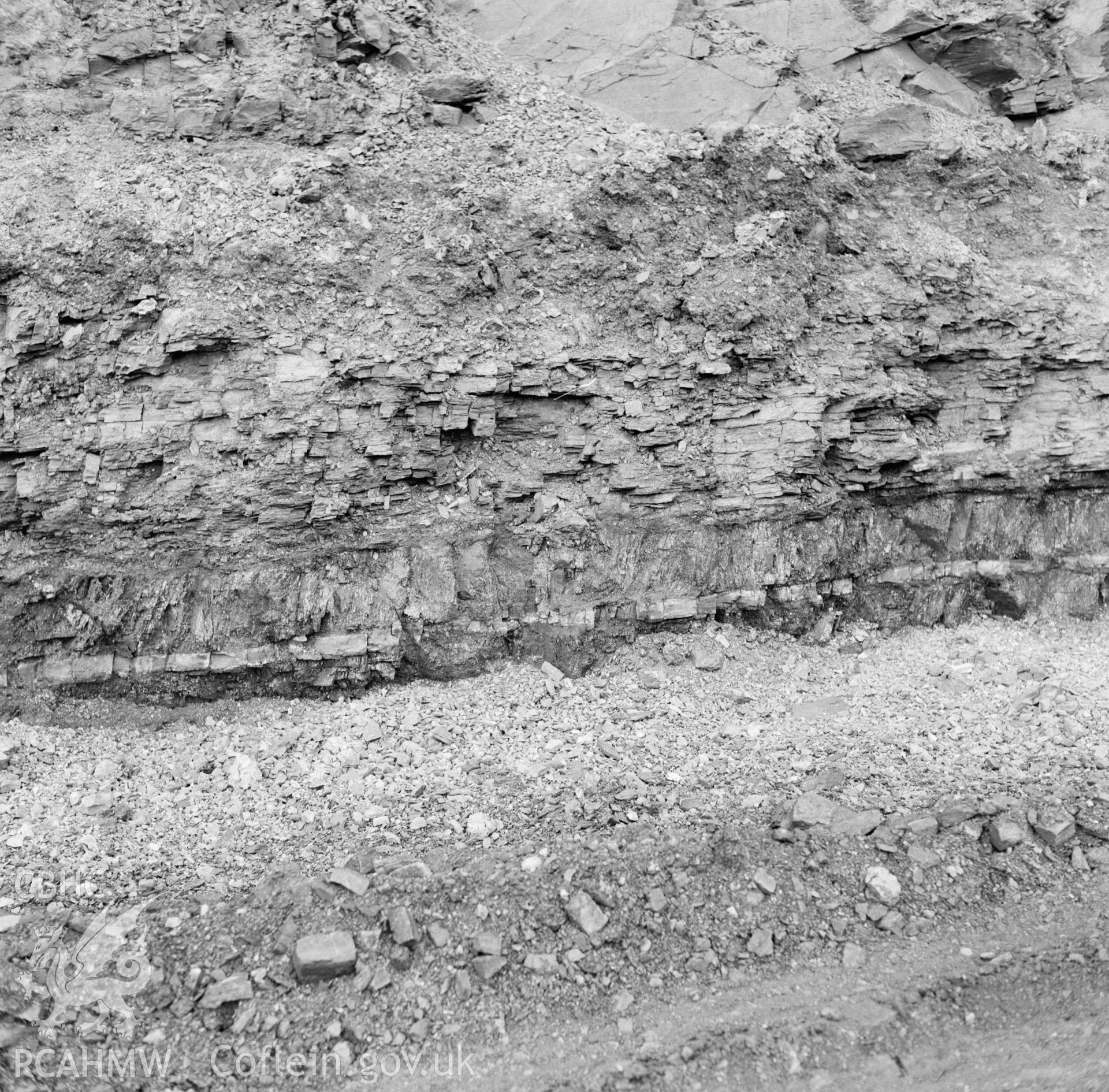 Digital copy of a black and white negative showing view of trench seam at Dowlais Top Opencast Mine, taken by Douglas Hague, undated.