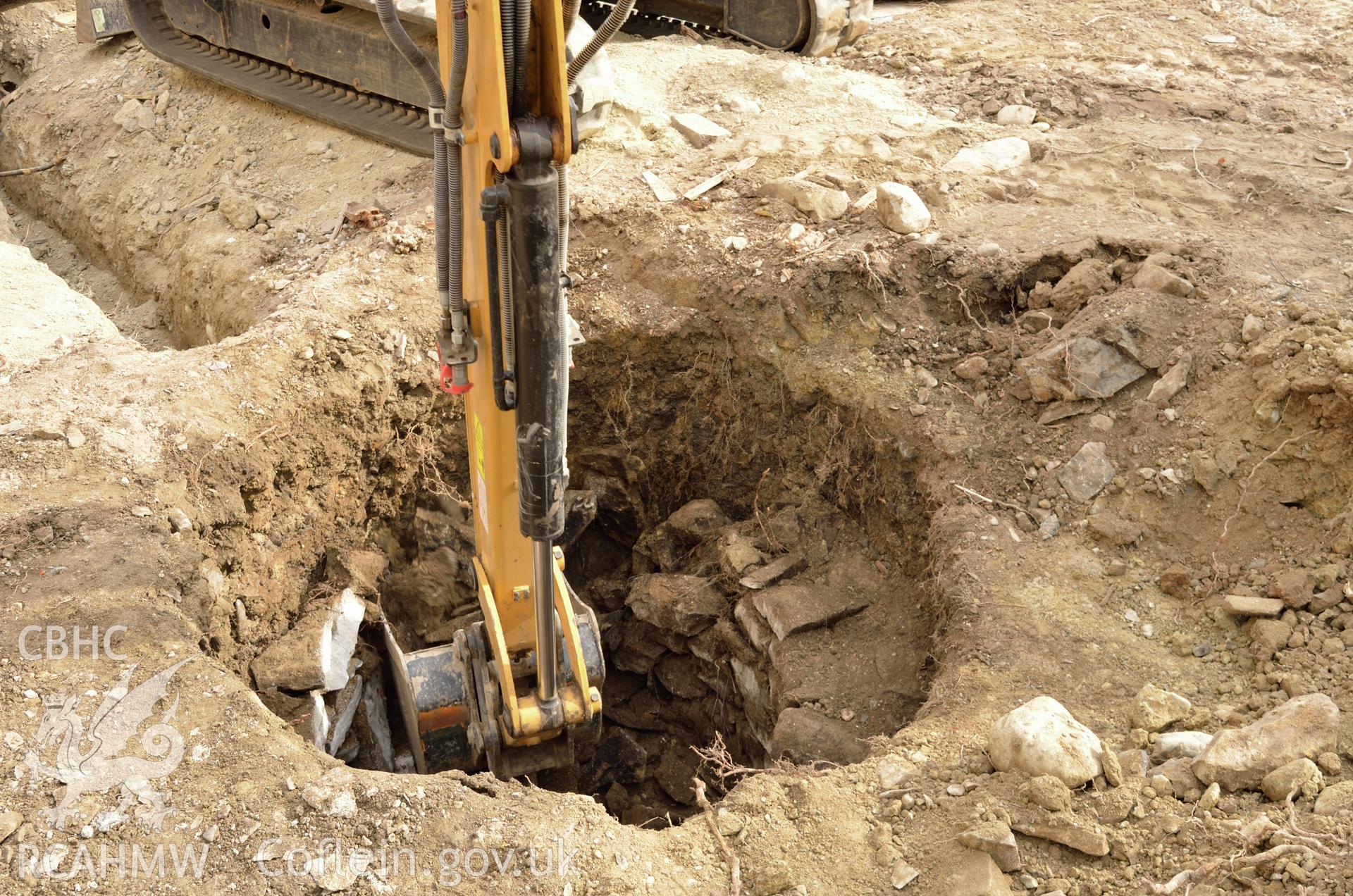 'Excavation of well, viewed from south.' Photographed by Gwynedd Archaeological Trust as part of archaeological mitigation report for well at Plas Celynin, Henryd, Conwy, on 6th August 2018. Project no. G2568.