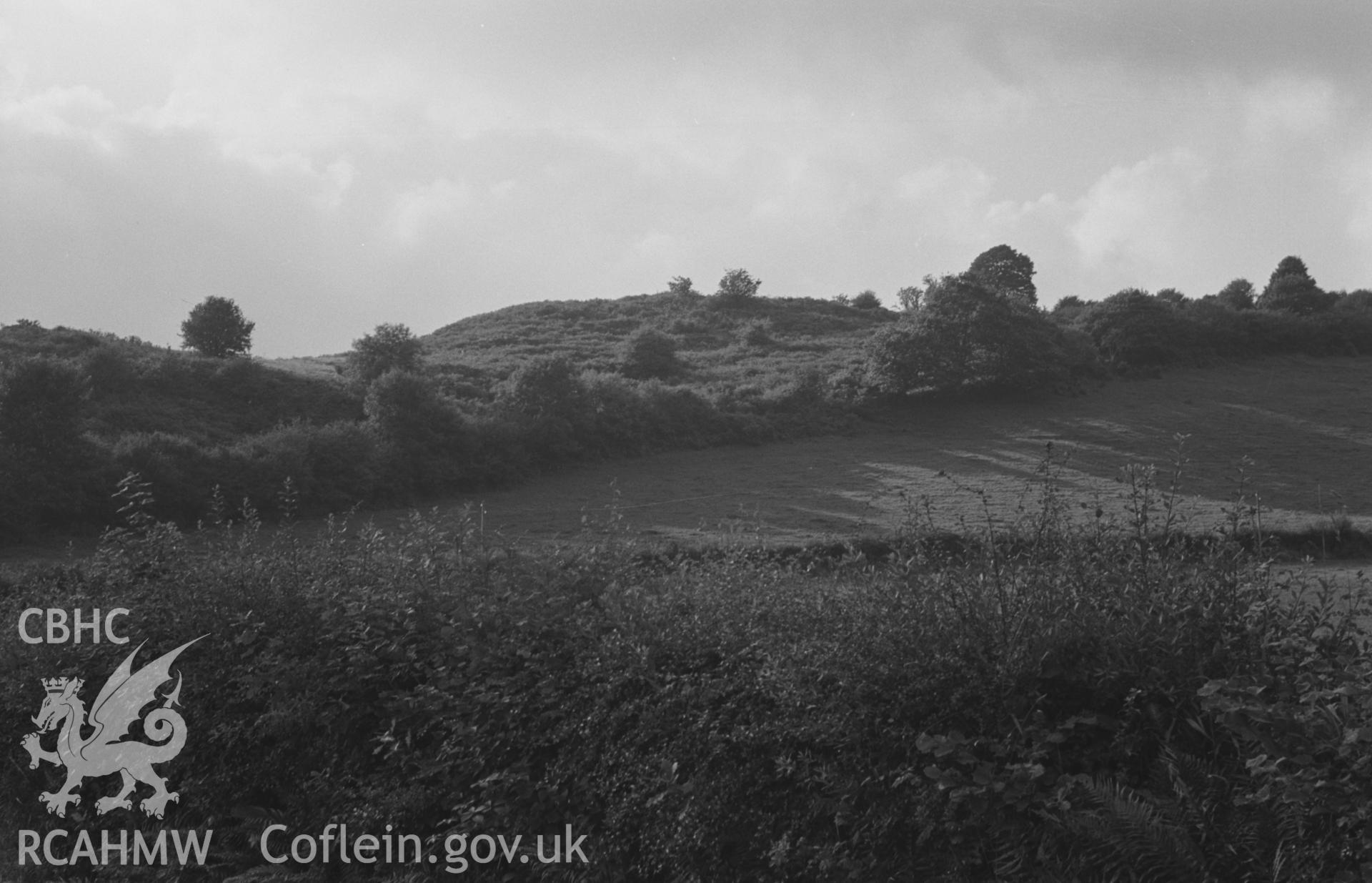 Digital copy of a black and white negative showing iron age camp Gaer, Troedyrhiw, Llandysul. Photographed by Arthur O. Chater on 19th August 1967 looking west north west from Grid Reference SN 392 459.