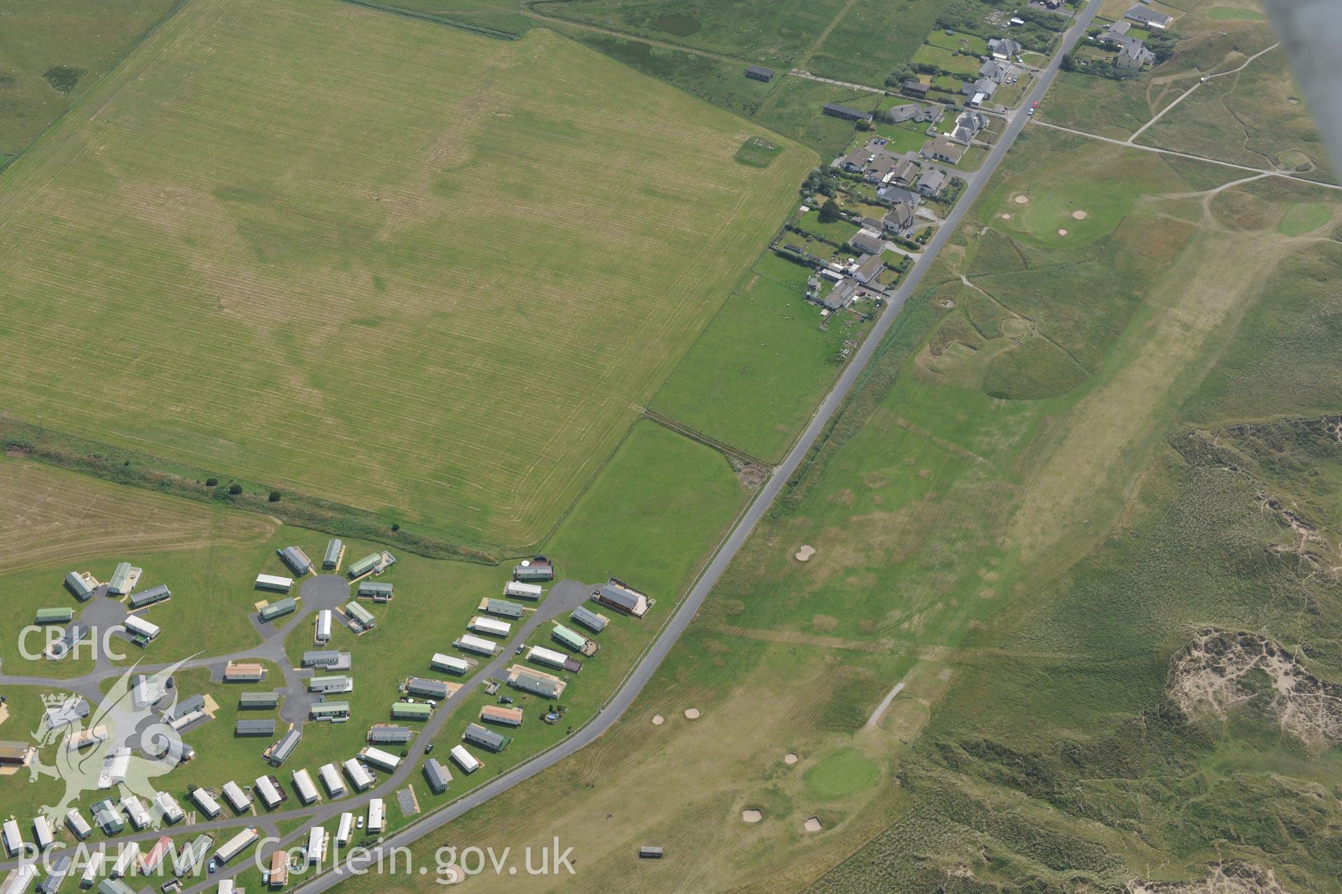 The village of Ynys Las, Ceredigion. Oblique aerial photograph taken during the Royal Commission?s programme of archaeological aerial reconnaissance by Toby Driver on 12th July 2013.