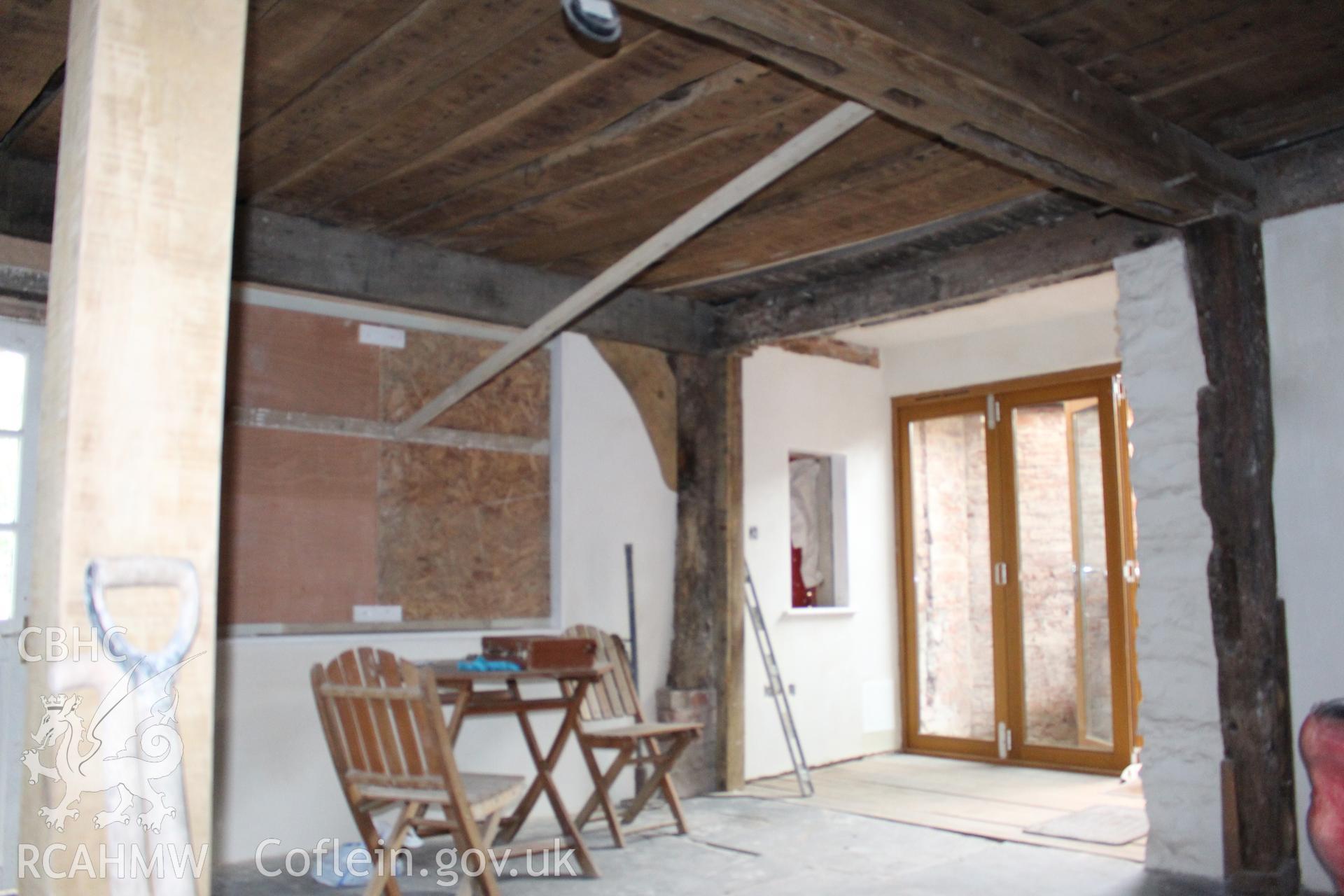 Colour photograph showing interior view of timber frame and ceiling at Porth y Dwr, Clwyd Street, Ruthin. Photograph taken during survey conducted by Geoff Ward on 9th October 2014.