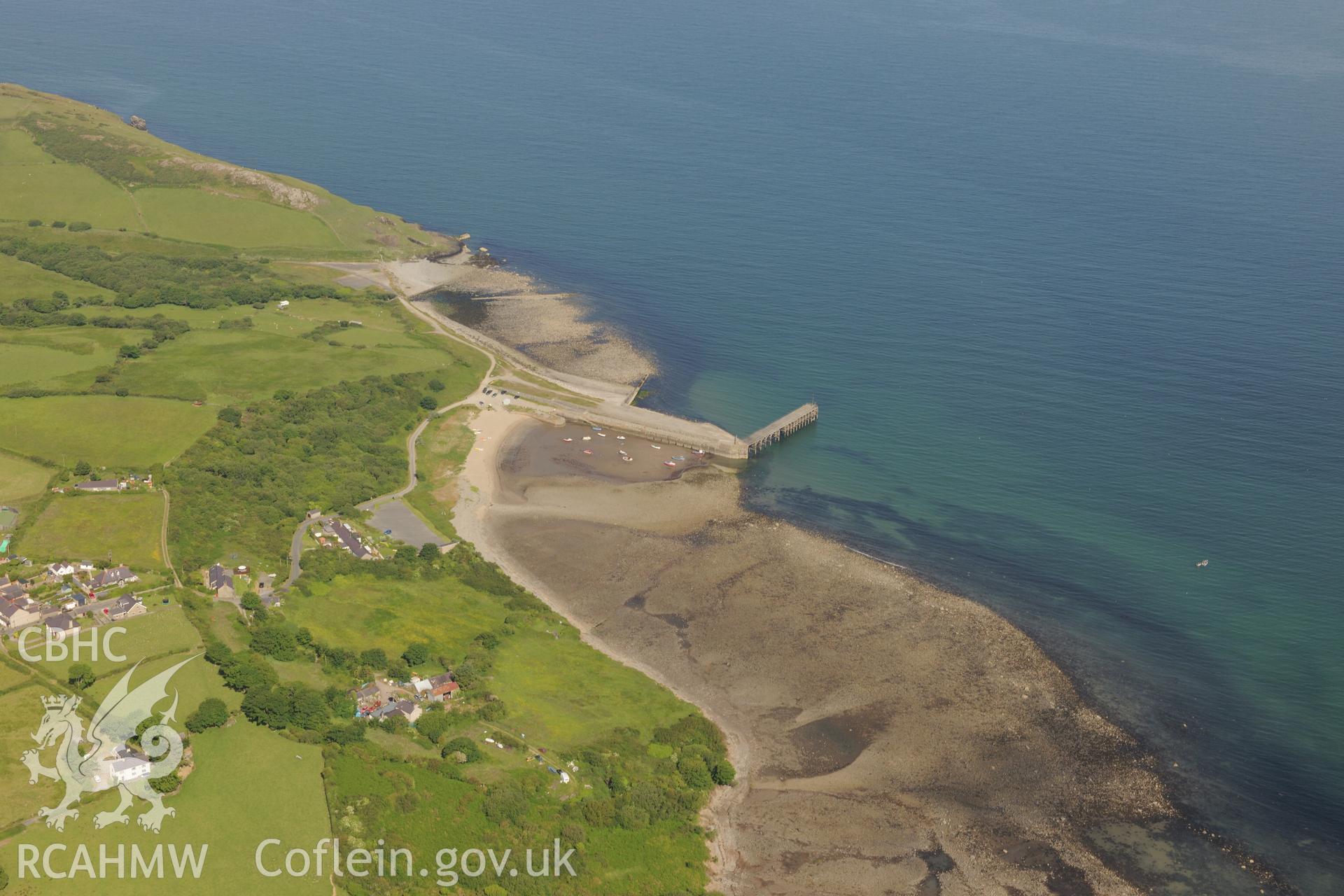 Trevor Pier and its wooden extension, Caernarfon Bay. Oblique aerial photograph taken during the Royal Commission's programme of archaeological aerial reconnaissance by Toby Driver on 23rd June 2015.