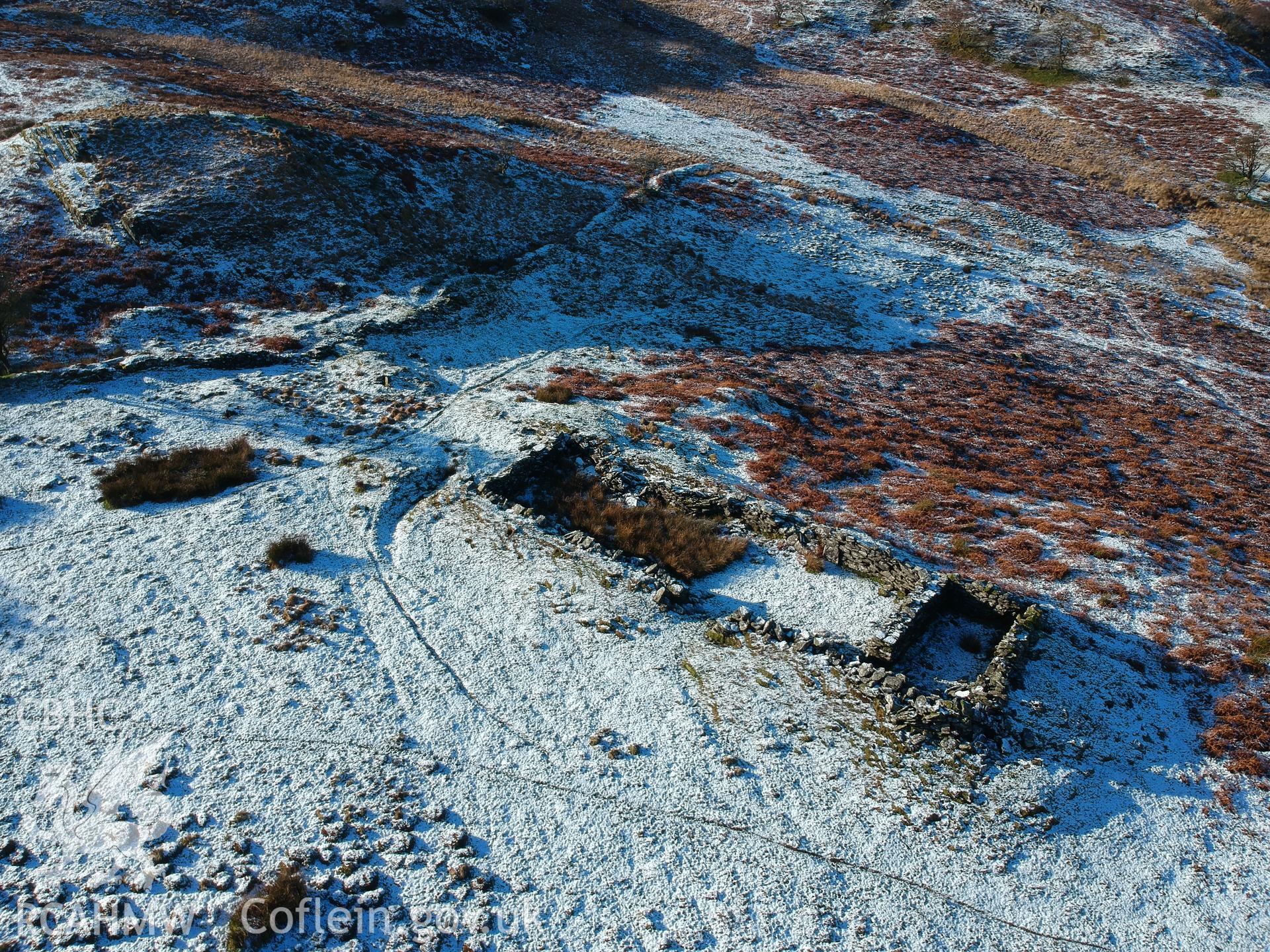 Aerial view showing remains of deserted, dry-stone walled Hafod Eidos rural settlement, Cwm Mwyro. Colour photograph taken by Paul R. Davis on 17th January 2019.