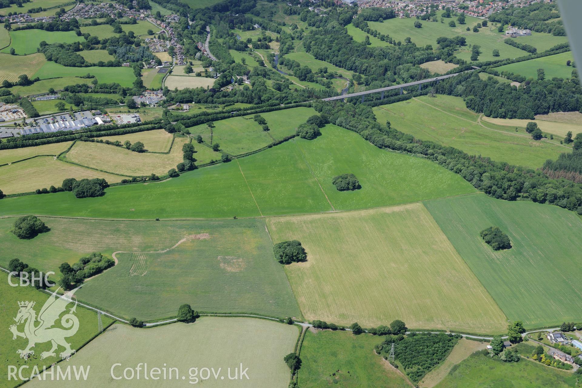 The Ceiriog Viaduct with the town of Chirk beyond. Oblique aerial photograph taken during the Royal Commission's programme of archaeological aerial reconnaissance by Toby Driver on 30th June 2015.
