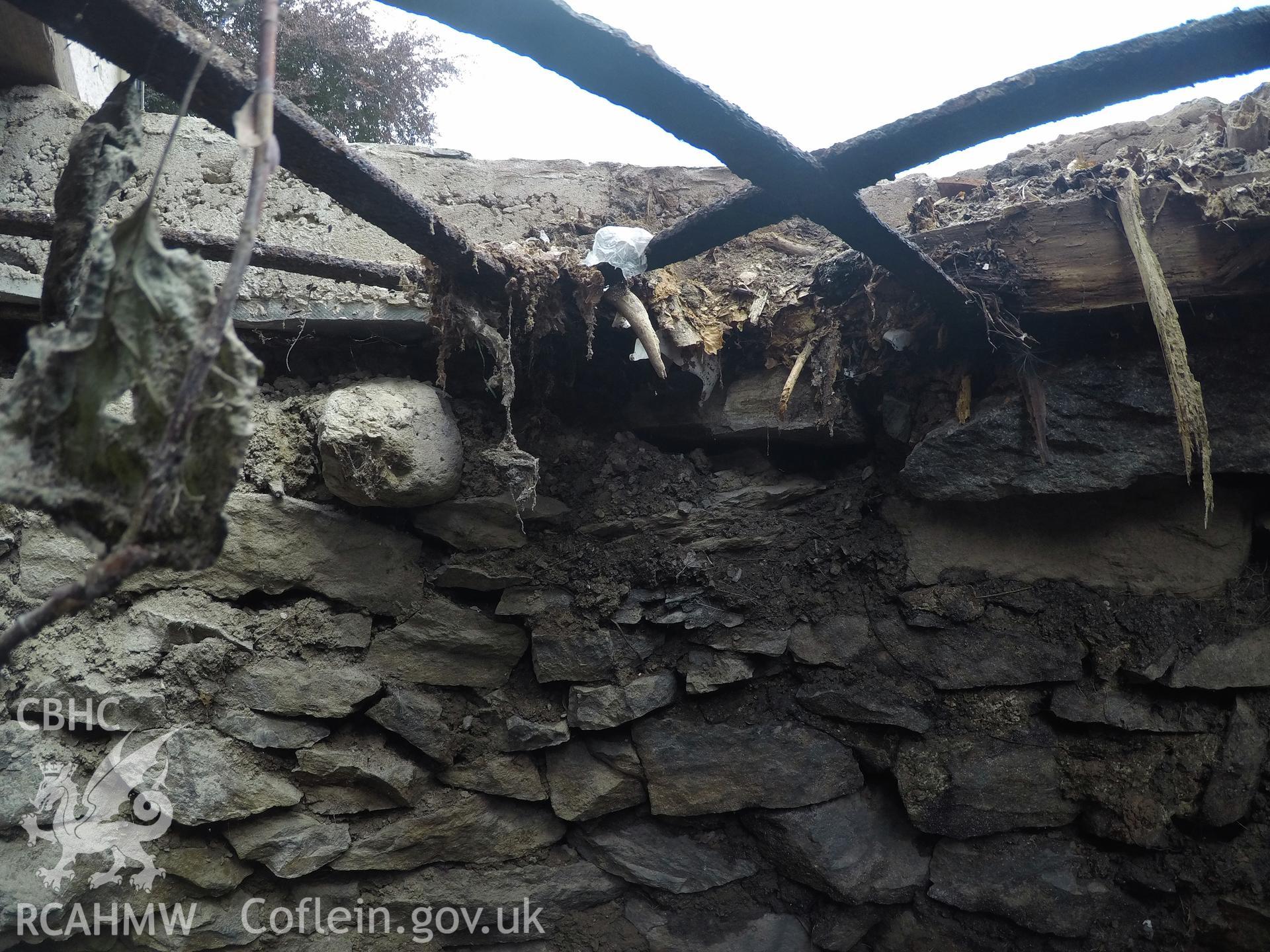 'View from north of well interior at 0.4m depth.' Photographed by Gwynedd Archaeological Trust as part of archaeological mitigation report for well at Plas Celynin, Henryd, Conwy, on 1st August 2018. Project no. G2568.