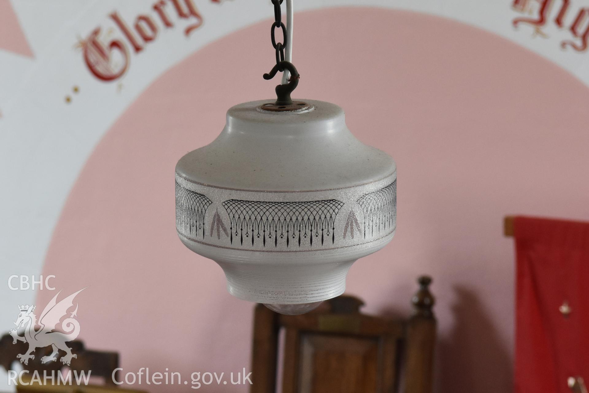 Colour photograph showing detail of lampshade at the Baptist & Unitarian Chapel, Nottage, Porthcawl. Taken during photographic survey conducted by Sue Fielding on 12th May 2018.