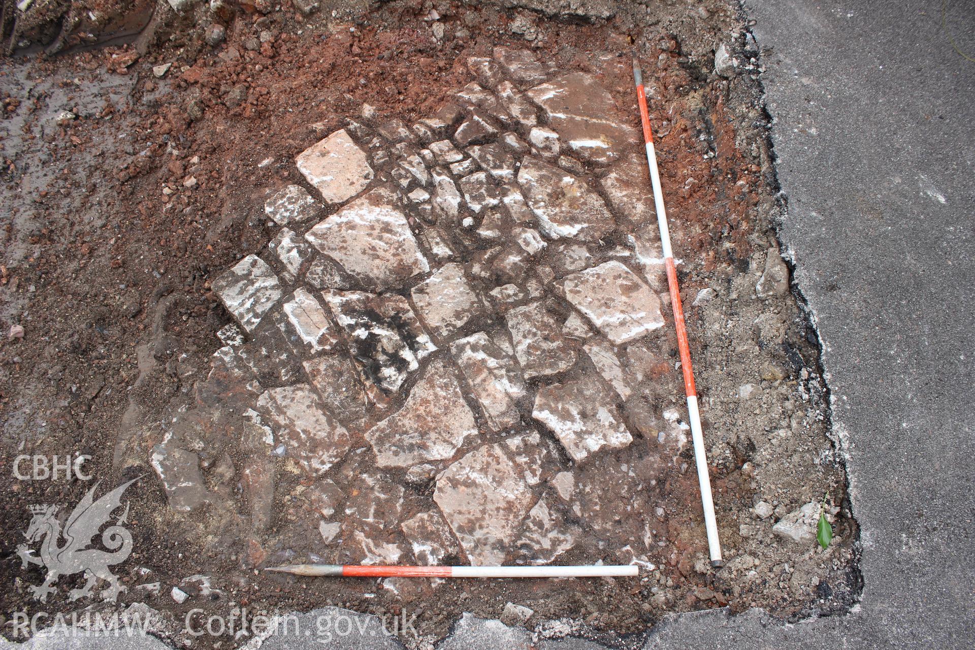 Detail shot of cobbled surfaces. Photographed as part of an Archaeological Evaluation of The Bridge Inn, Chepstow, carried out by Archaeology Wales, 2015.
