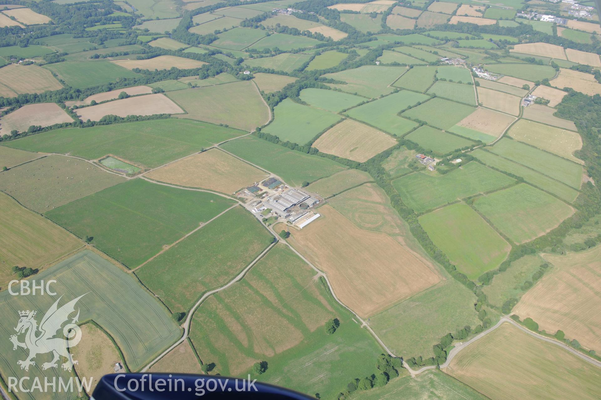 Pelcombe Rath defended enclosure north west of Haverford West. Oblique aerial photograph taken during the Royal Commission?s programme of archaeological aerial reconnaissance by Toby Driver on 16th July 2013.