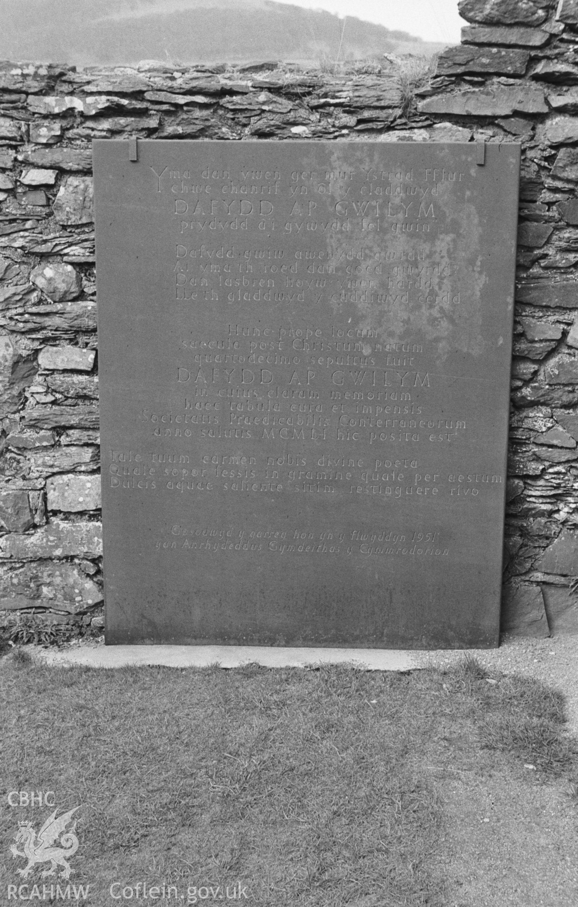 Digital copy of black & white negative showing memorial stone for Dafydd ap Gwilym fixed to inside of north wall of north transept of Strata Florida Abbey, Pontrhydfendigaid. Photographed in April 1964 by Arthur O. Chater from Grid Reference SN 7468 6574.