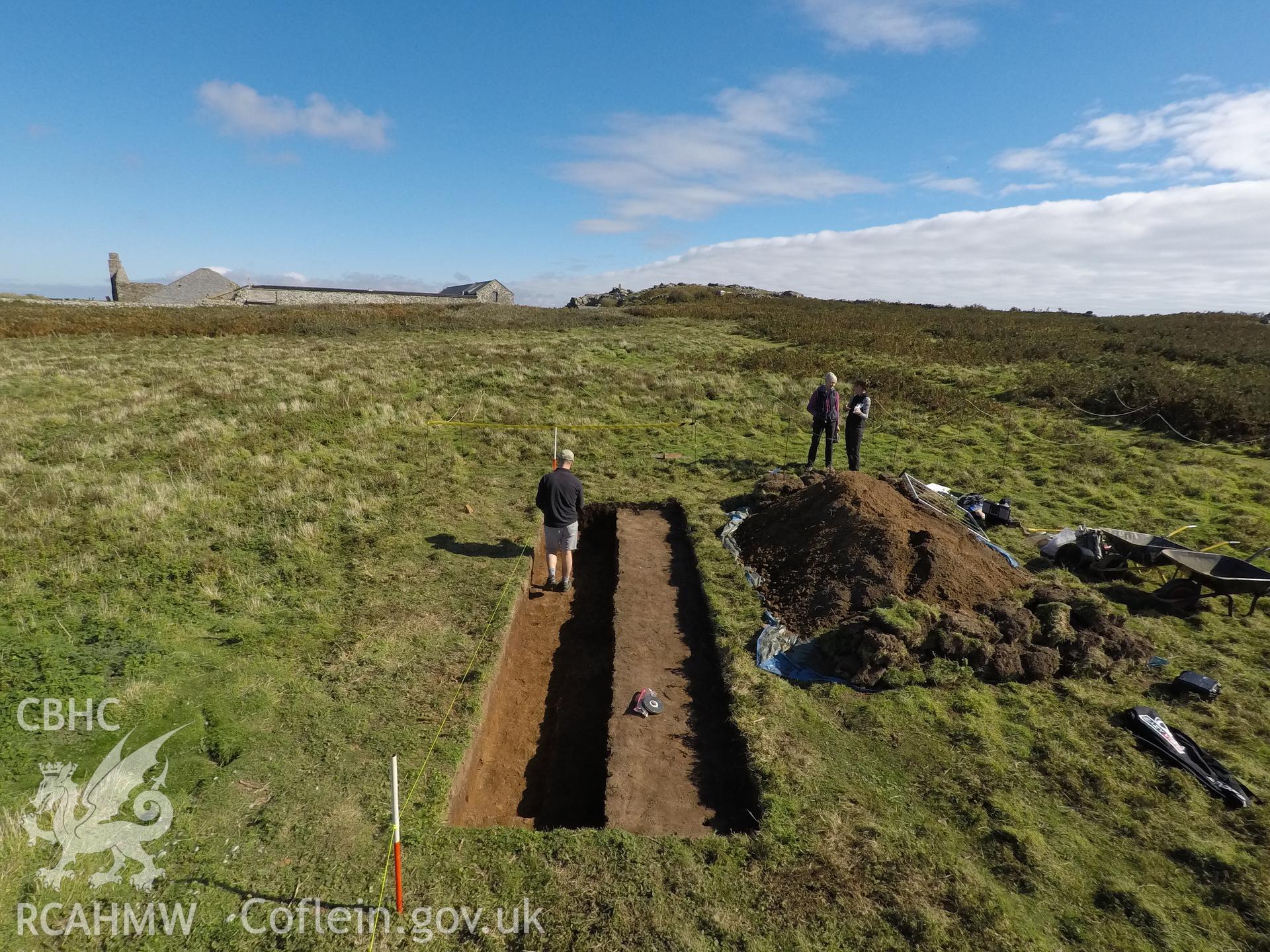 Investigator's photography showing the evaluation excavation of a geophysical anomaly in Well Meadow, Skomer Island, between 25-27th Sept 2018 as part of the Skomer Island Project. High view of trench from west.