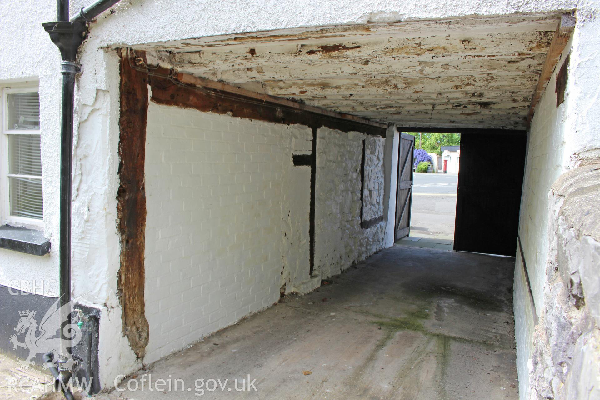 Colour photograph showing interior view of external covered vehicular opening on left of No 5 Mwrog Street, Ruthin. Photographed during survey conducted by Geoff Ward on 14th May 2014.