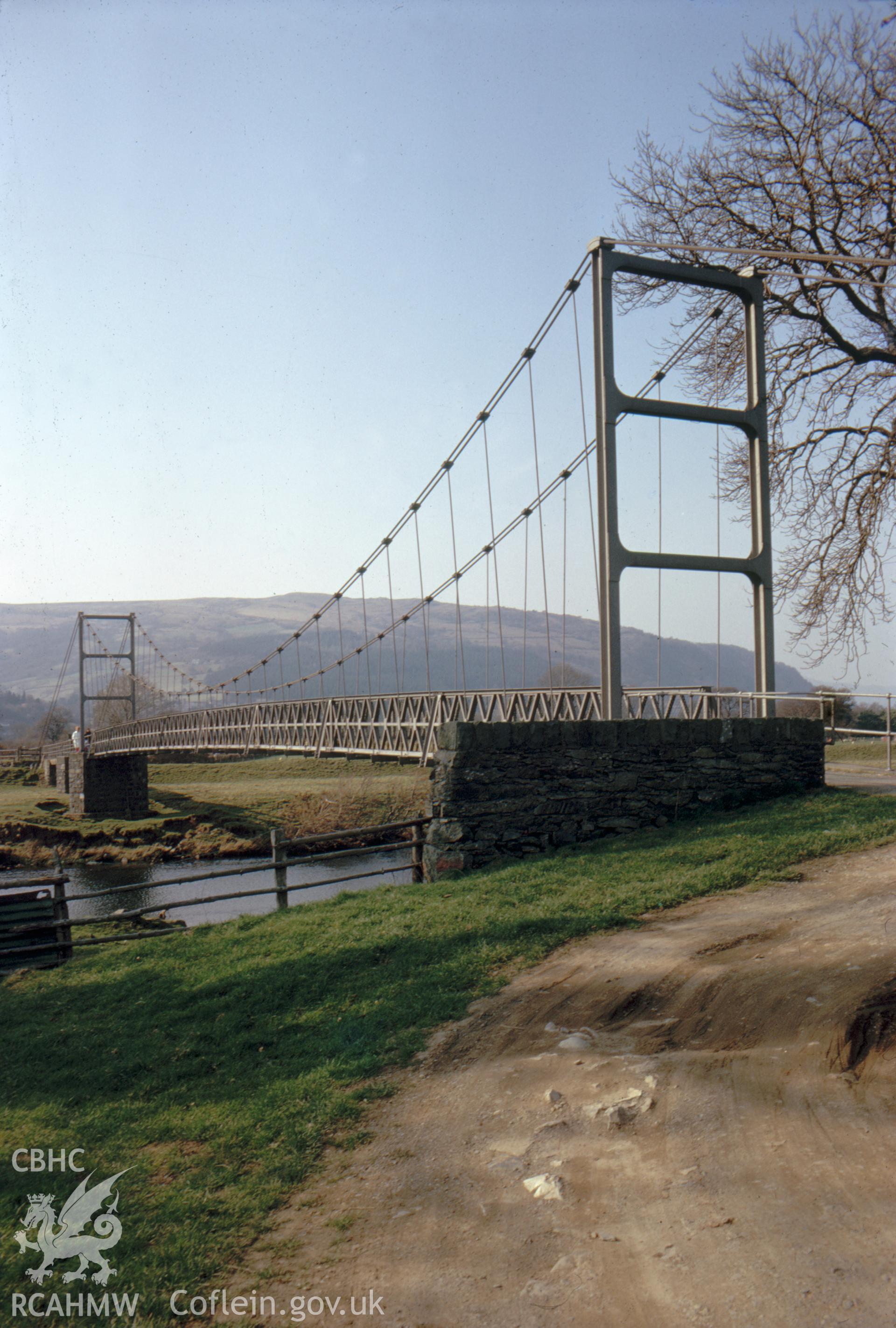 Digital copy of a colour slide showing view of the suspension bridge at Llanrwst, taken by Douglas Hague, c1970.