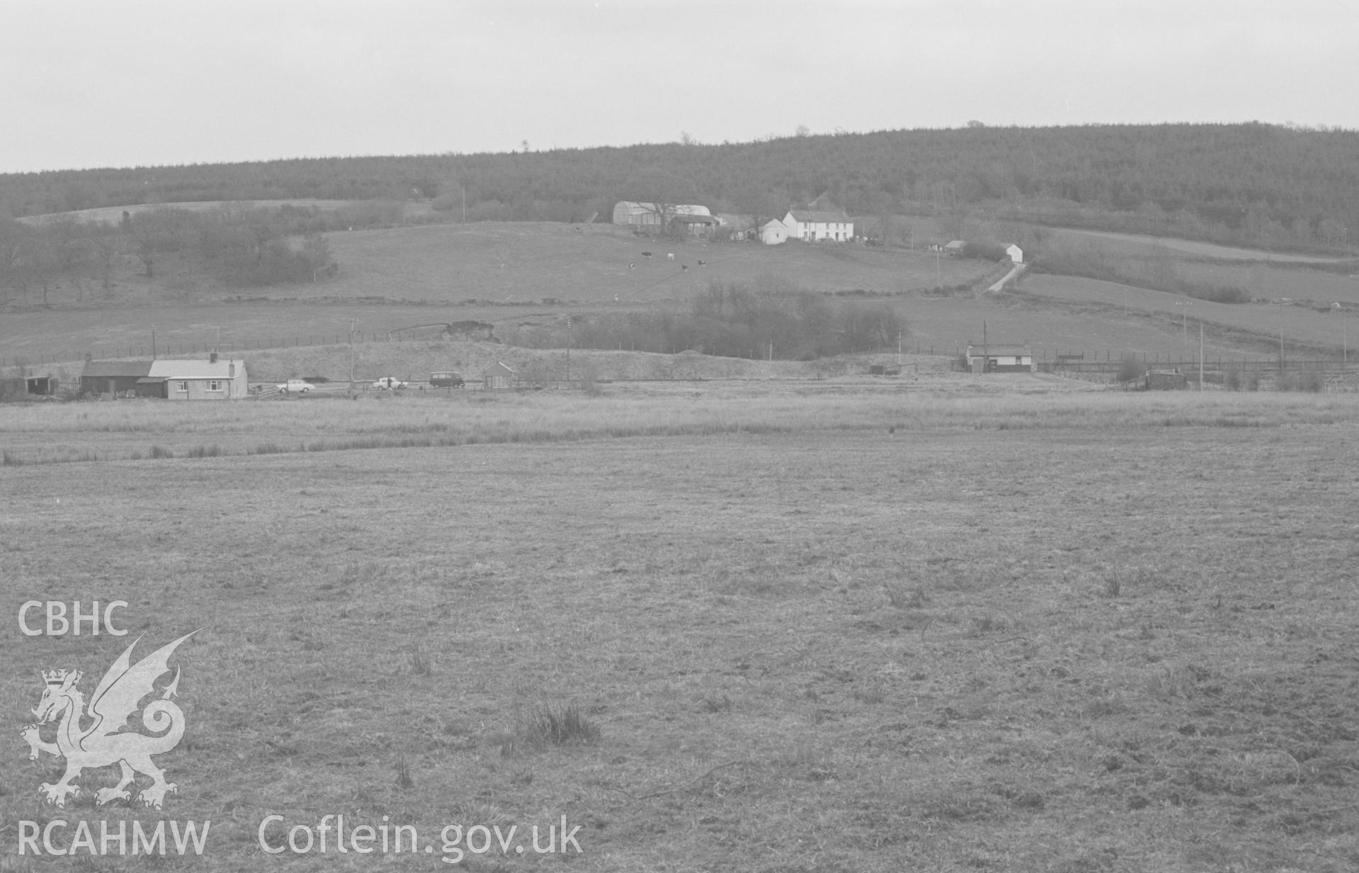 Digital copy of a black and white negative showing view of Goetre Isaf farm (right) and remains of Derry Ormond station (left). Photographed by Arthur O. Chater on 7th April 1968 looking south east from Bettws Bledrws at Grid Reference SN 595 518.