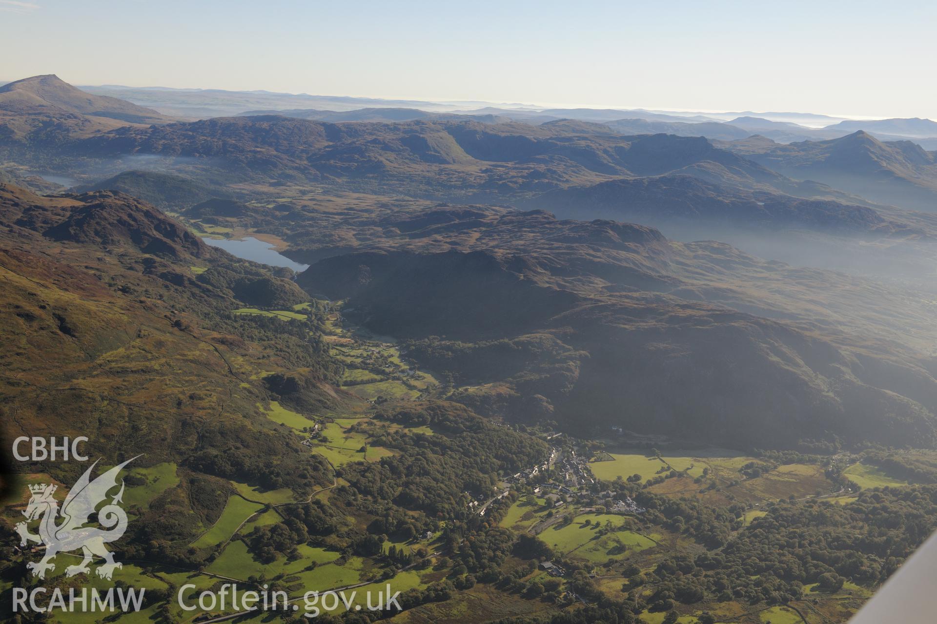 View from the west of Beddgelert, in the Glaslyn valley. Oblique aerial photograph taken during the Royal Commission's programme of archaeological aerial reconnaissance by Toby Driver on 2nd October 2015.