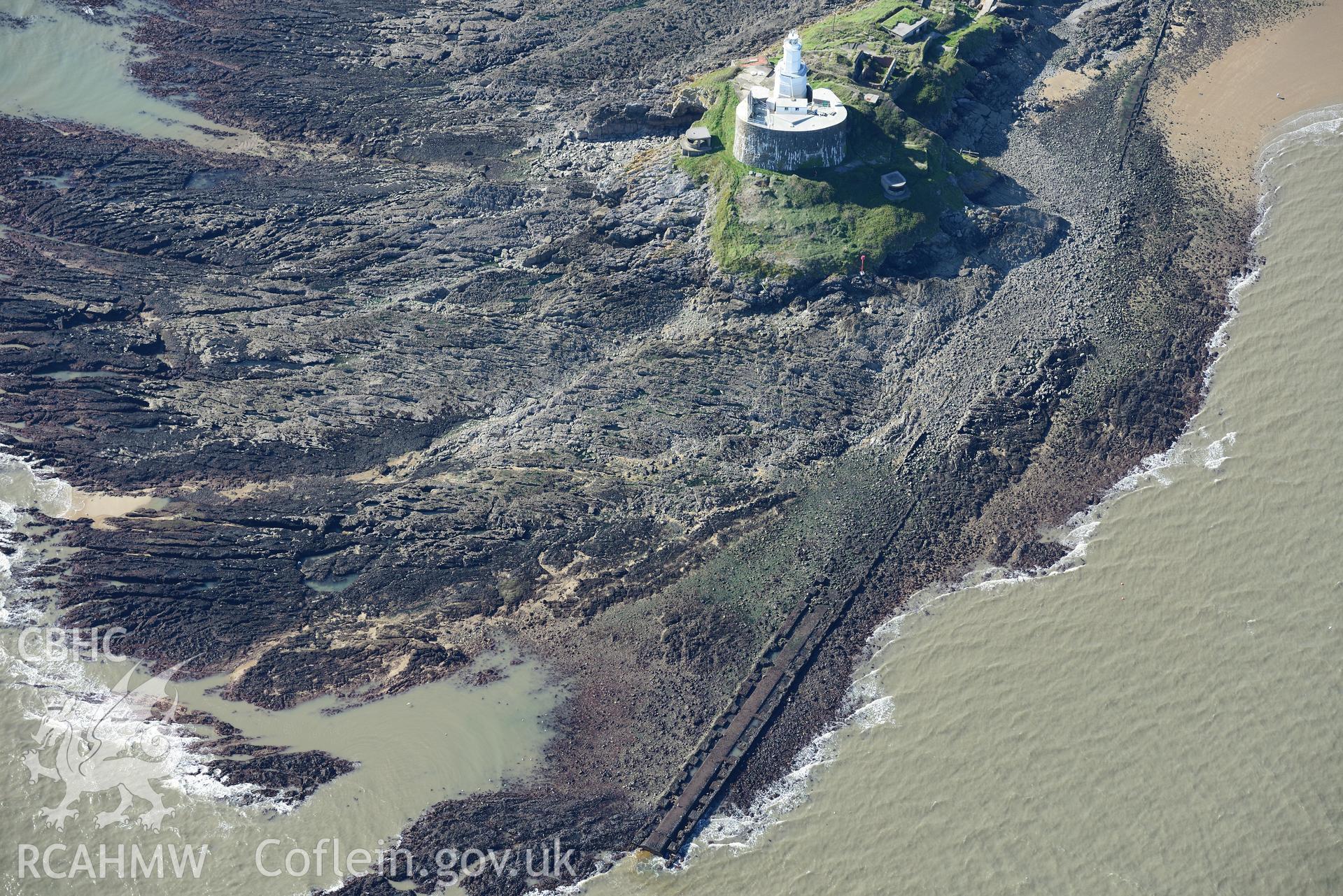 Mumbles fort, coast artillery searchlights and Mumbles lighthouse on south western edge of Swansea Bay. Oblique aerial photograph taken during the Royal Commission's programme of archaeological aerial reconnaissance by Toby Driver, 30th September 2015.