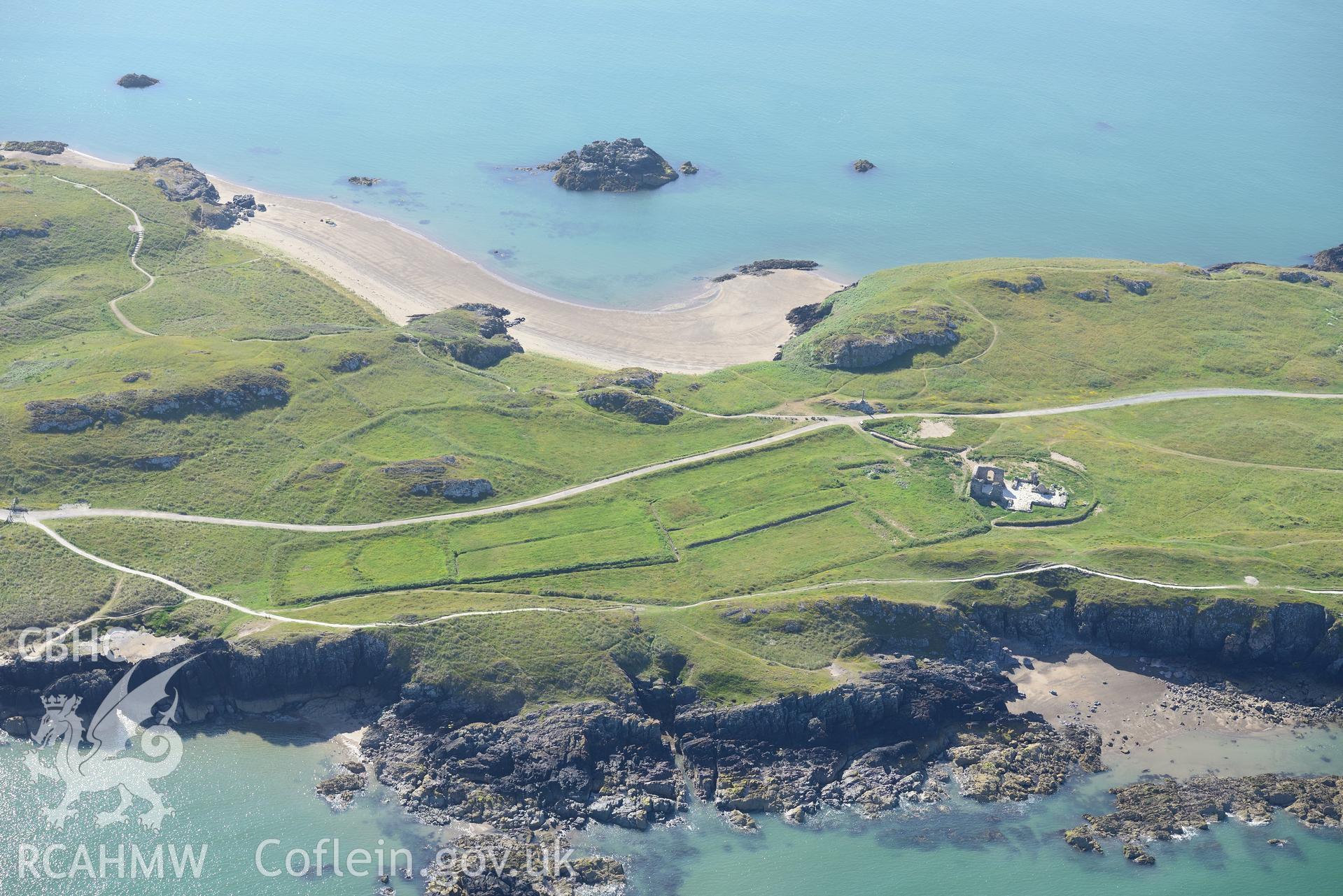 Remains of St. Dwynwen's church, Llanddwyn Island. Oblique aerial photograph taken during the Royal Commission's programme of archaeological aerial reconnaissance by Toby Driver on 23rd June 2015.