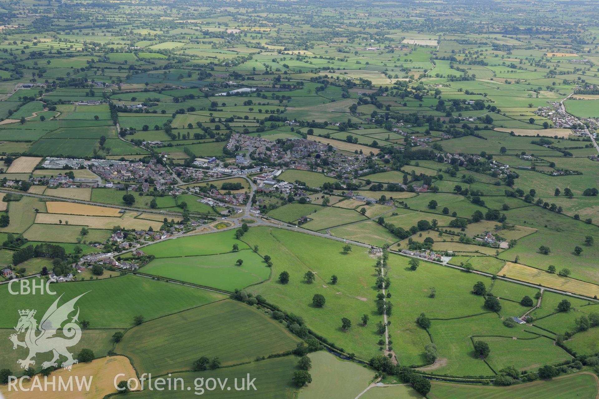 The village of Four Crosses, between Welshpool and Oswestry. Oblique aerial photograph taken during the Royal Commission's programme of archaeological aerial reconnaissance by Toby Driver on 30th June 2015.