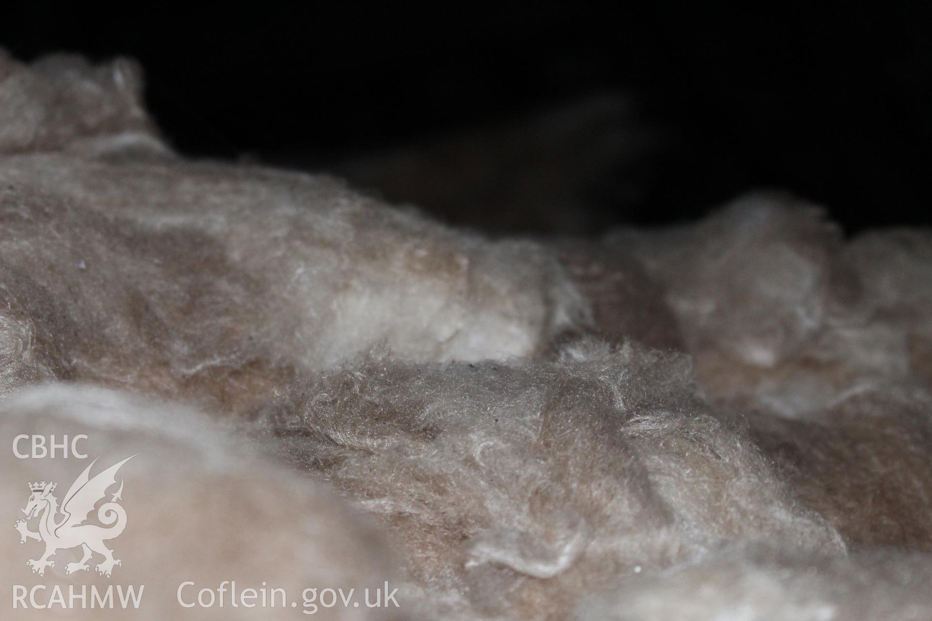 Colour photograph showing detail of insulating wool at 5-7 Mwrog Street, Ruthin. Photographed during survey conducted by Geoff Ward on 14th May 2014.