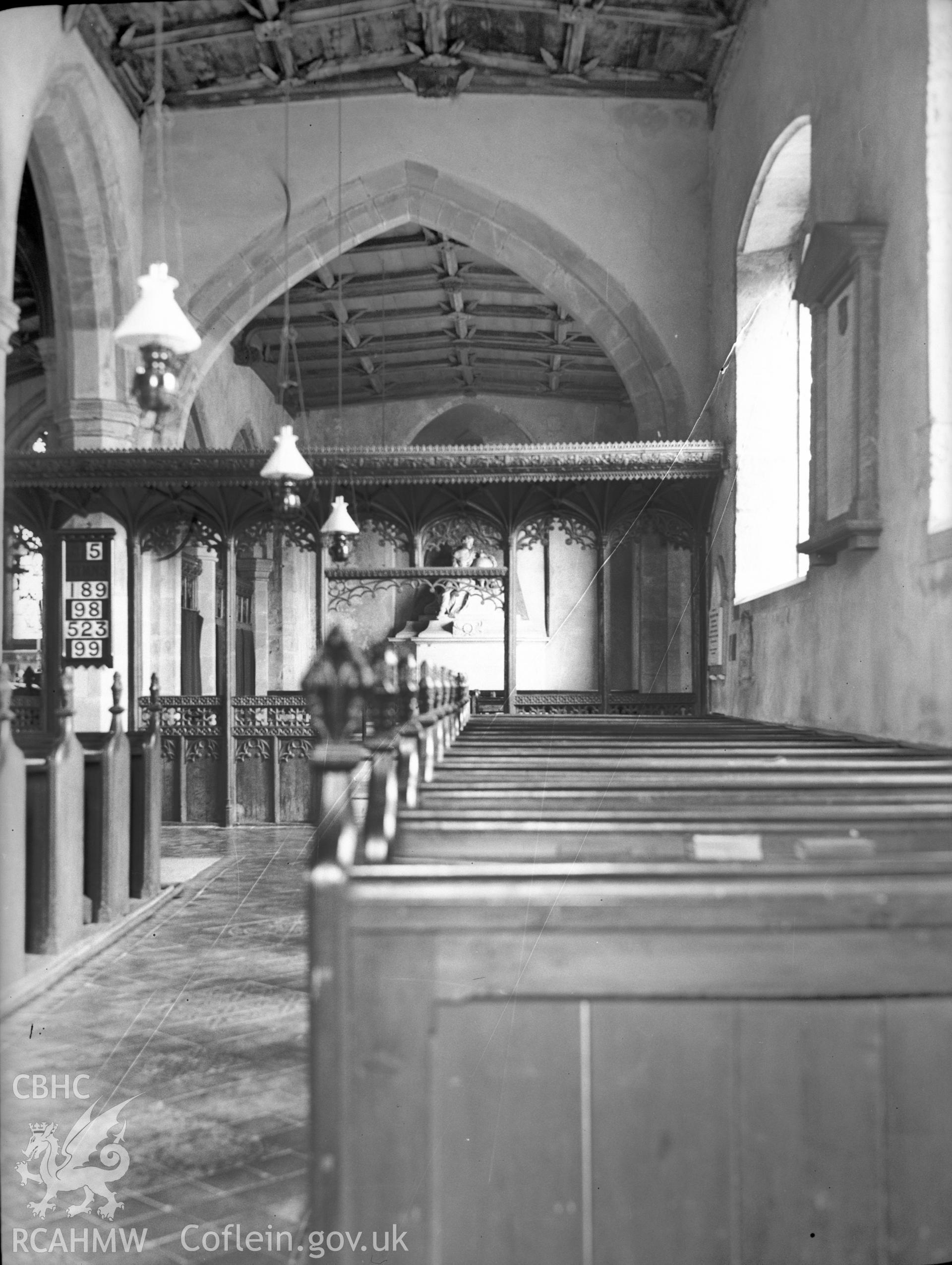 Digital copy of a nitrate negative showing interior view of south aisle and screen from west, St Stephen's Church, Old Radnor.  From the National Building Record Postcard Collection.