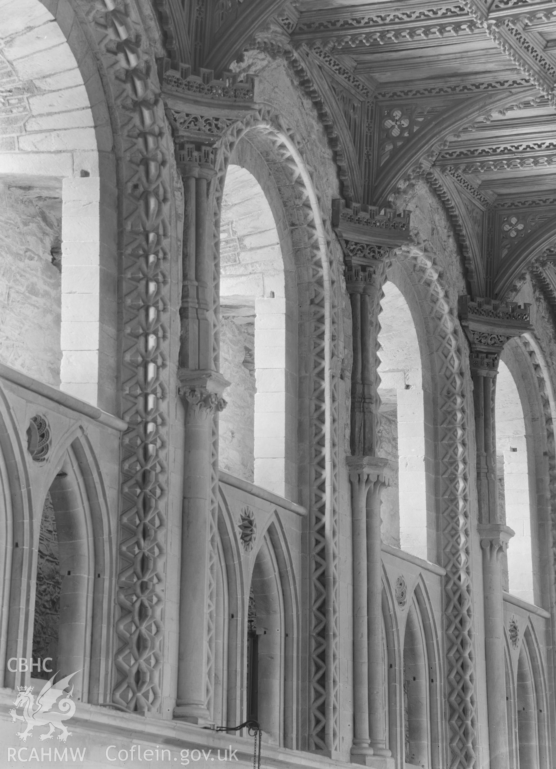 Digital copy of a black and white nitrate negative showing decorated window arches at St David's Cathedral, taken by E.W. Lovegrove, July 1936.