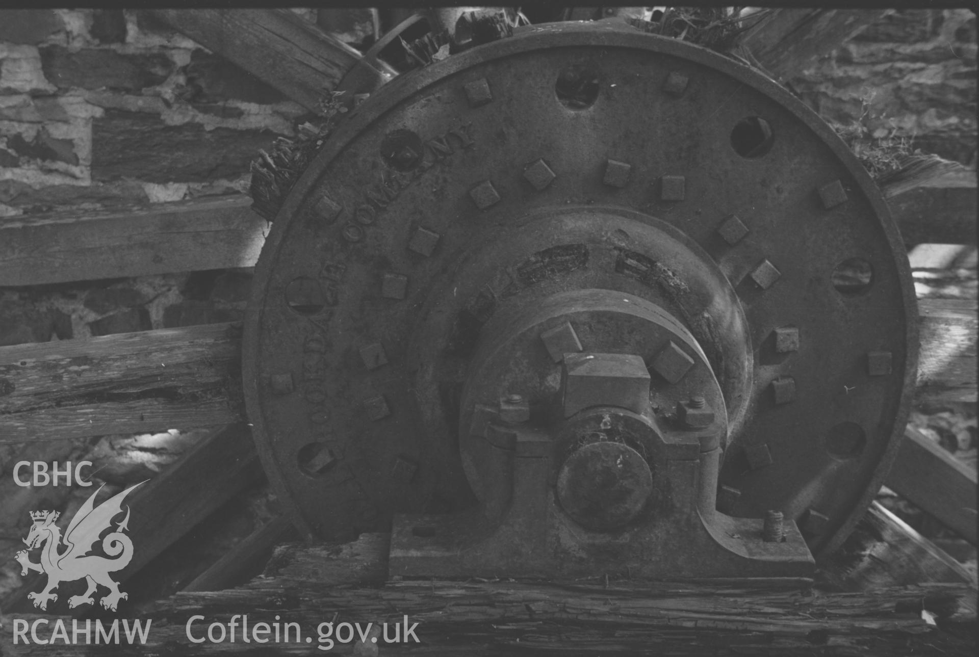 Digital copy of a black and white negative showing the hub and supports of the overshot, iron waterwheel of Felin Fflur, Ystrad Fflur. The hub is inscribed 'Coalbrookdale Company.'  Photographed by Arthur O. Chater in August 1967. (Looking north north west from Grid Reference SN 7204 6429).