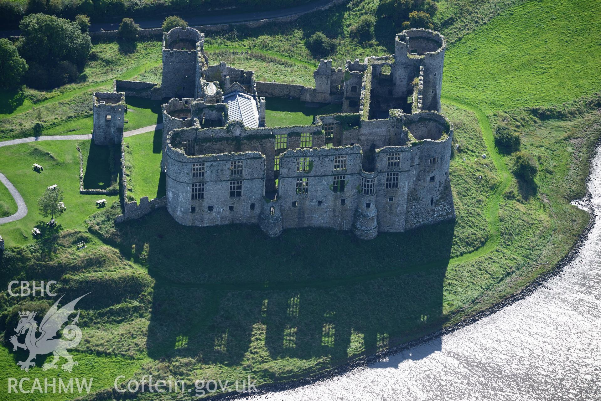 Carew Castle, its gardens and its grounds, Carew, east of Pembroke Dock. Oblique aerial photograph taken during the Royal Commission's programme of archaeological aerial reconnaissance by Toby Driver on 30th September 2015.