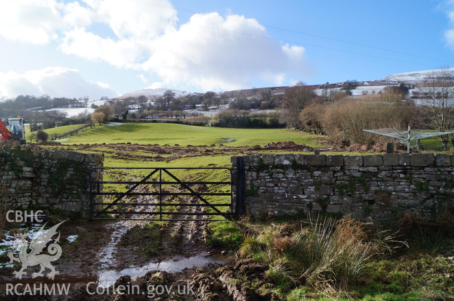 View 'looking southwest at the field to the south of the farmhouse with trenches for ground source heating visible' on Gwrlodau Farm, Llanbedr, Crickhowell. Photograph and description by Jenny Hall and Paul Sambrook of Trysor, 9th February 2018.