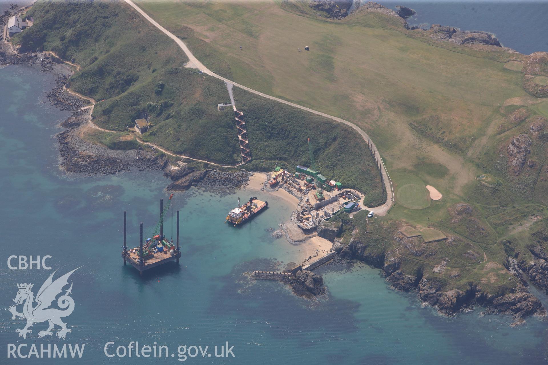 Lifeboat House, Lighthouse, Old Pier and Trwyn Porth Dinllaen Promontory Enclosure, Porth Dinllaen, Morfa Nefyn, on the Lleyn Peninsula. Oblique aerial photograph taken during the Royal Commission?s programme of archaeological aerial reconnaissance by Toby Driver on 12th July 2013.