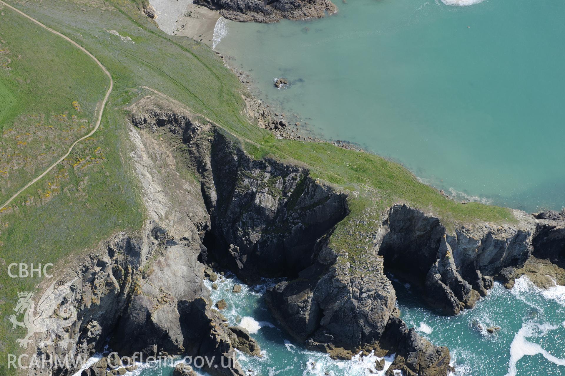 Dinas Fach defended enclosure and Porth Mynawyd landing place, Solva. Oblique aerial photograph taken during the Royal Commission's programme of archaeological aerial reconnaissance by Toby Driver on 13th May 2015.