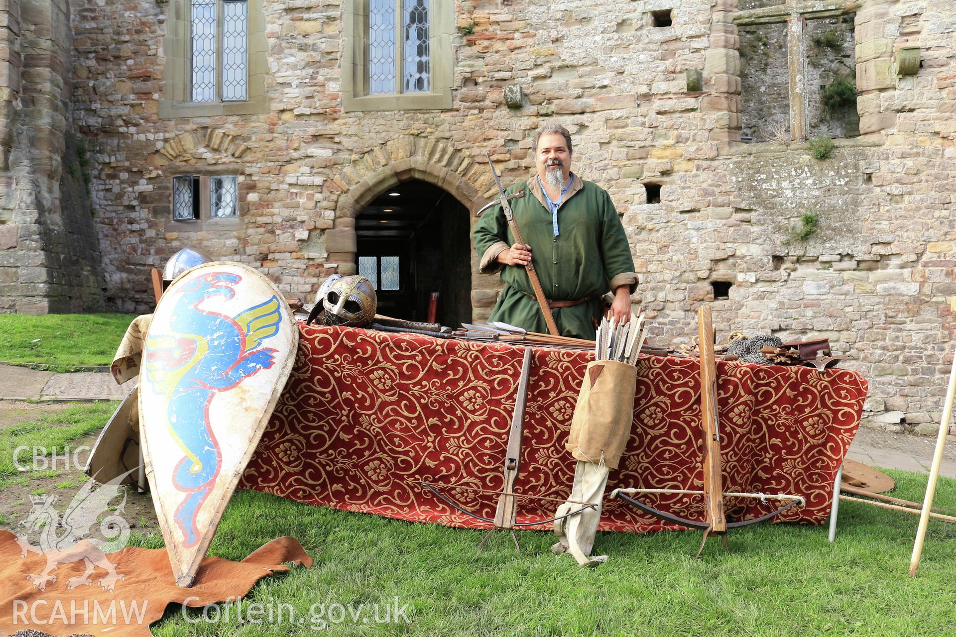Investigators Photographs at Chepstow Castle. Neil Eddiford from the Bowlore Medieval Group presenting a display of reconstructed medieval weapons and armour.